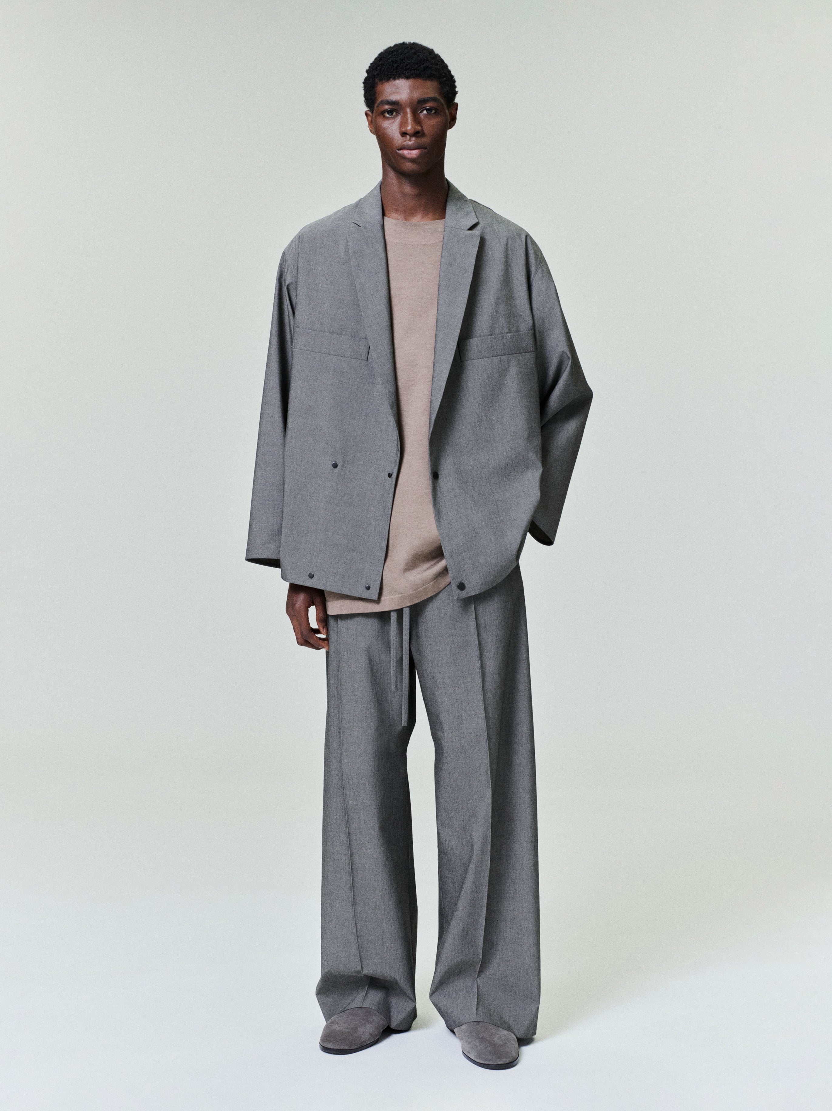 front view of relaxed-fit cotton-wool oxford shirt jacket in grey with two snap buttons and matching wide-leg pants