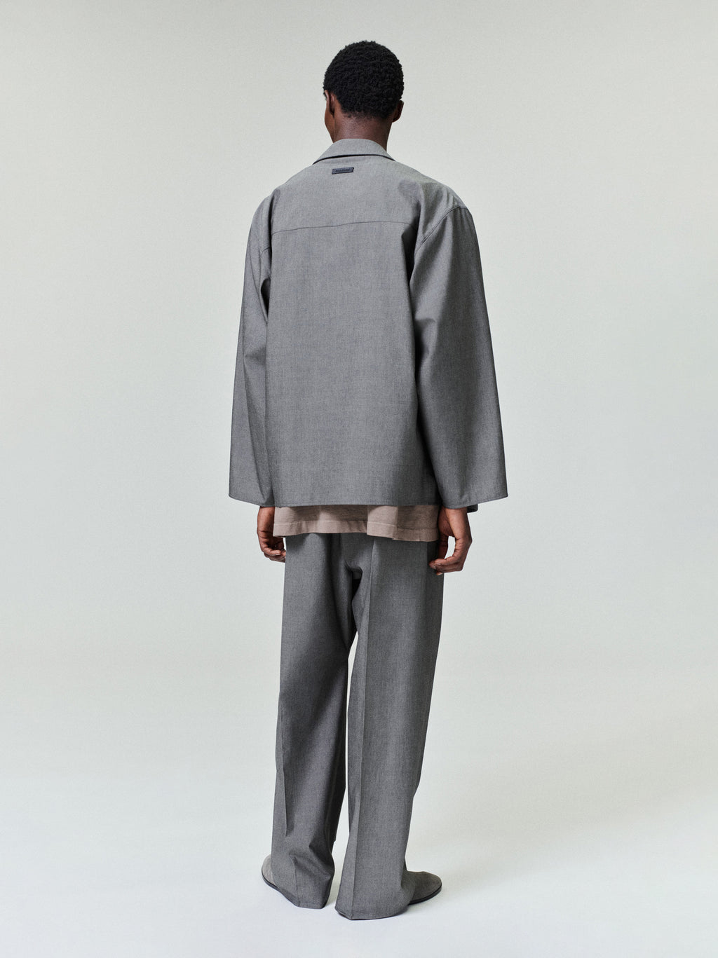 rear view of relaxed-fit cotton wool oxford shirt jacket in soft grey with long sleeves and straight hem