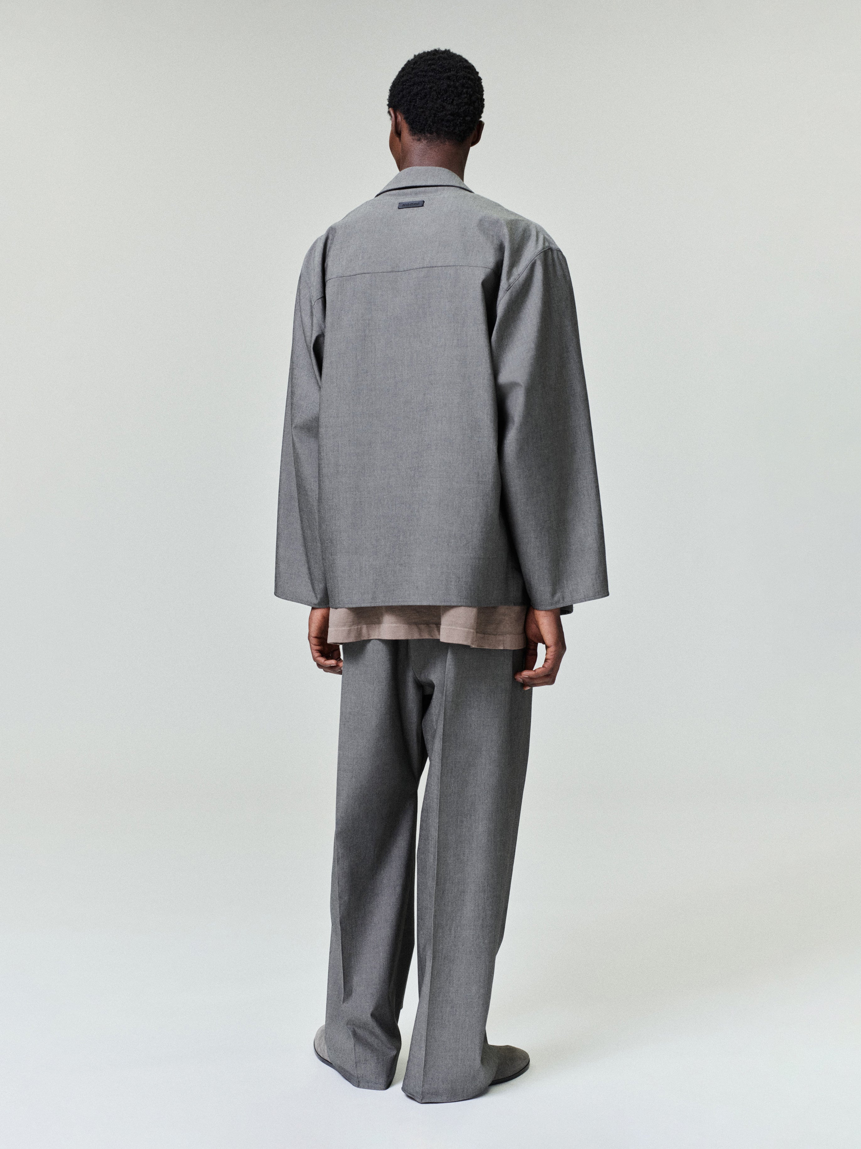 rear view of relaxed-fit cotton wool oxford shirt jacket in soft grey with long sleeves and straight hem