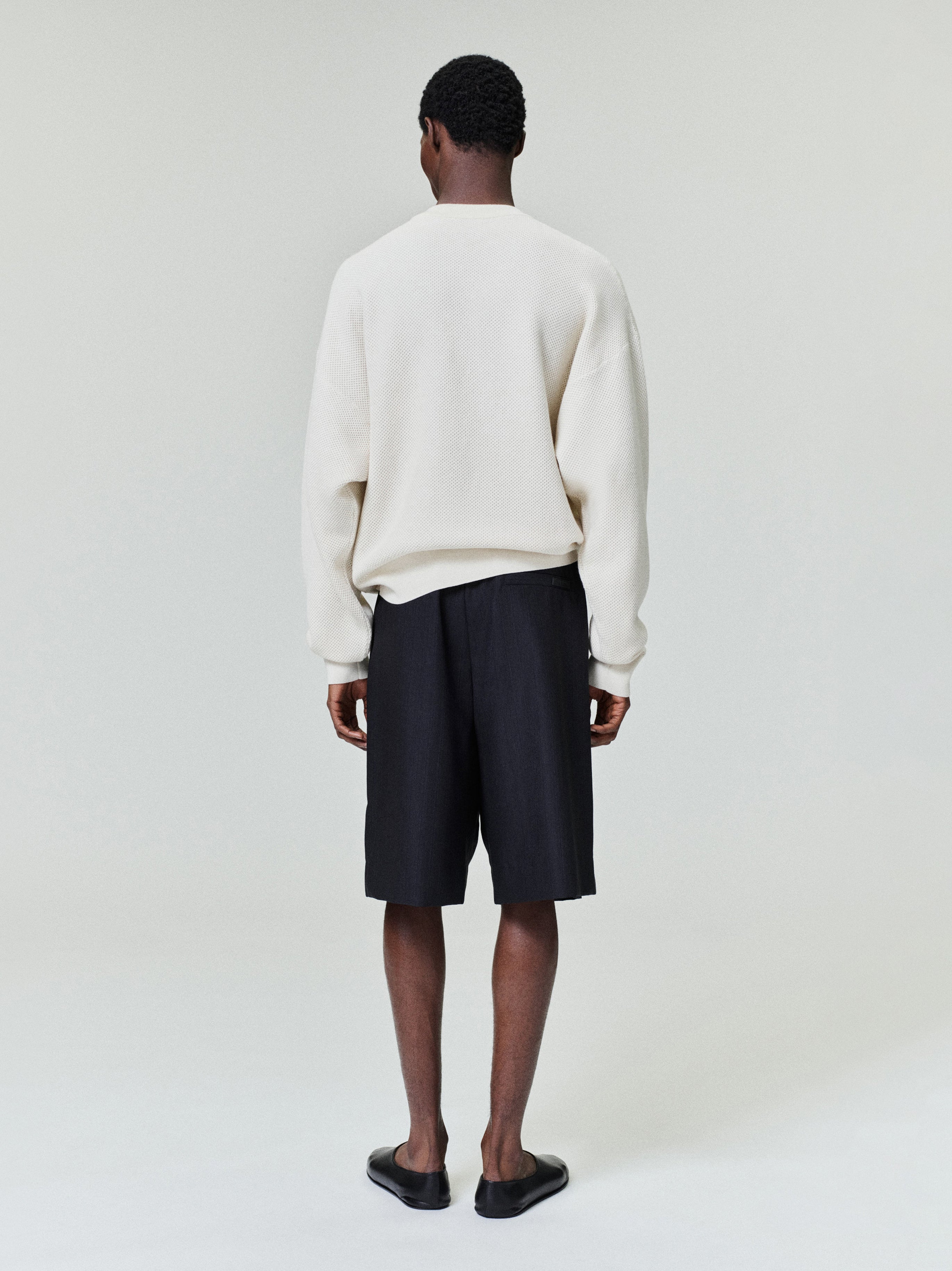 rear view of men's off-white relaxed fit double-knit sport mesh wool-cotton crewneck sweater
