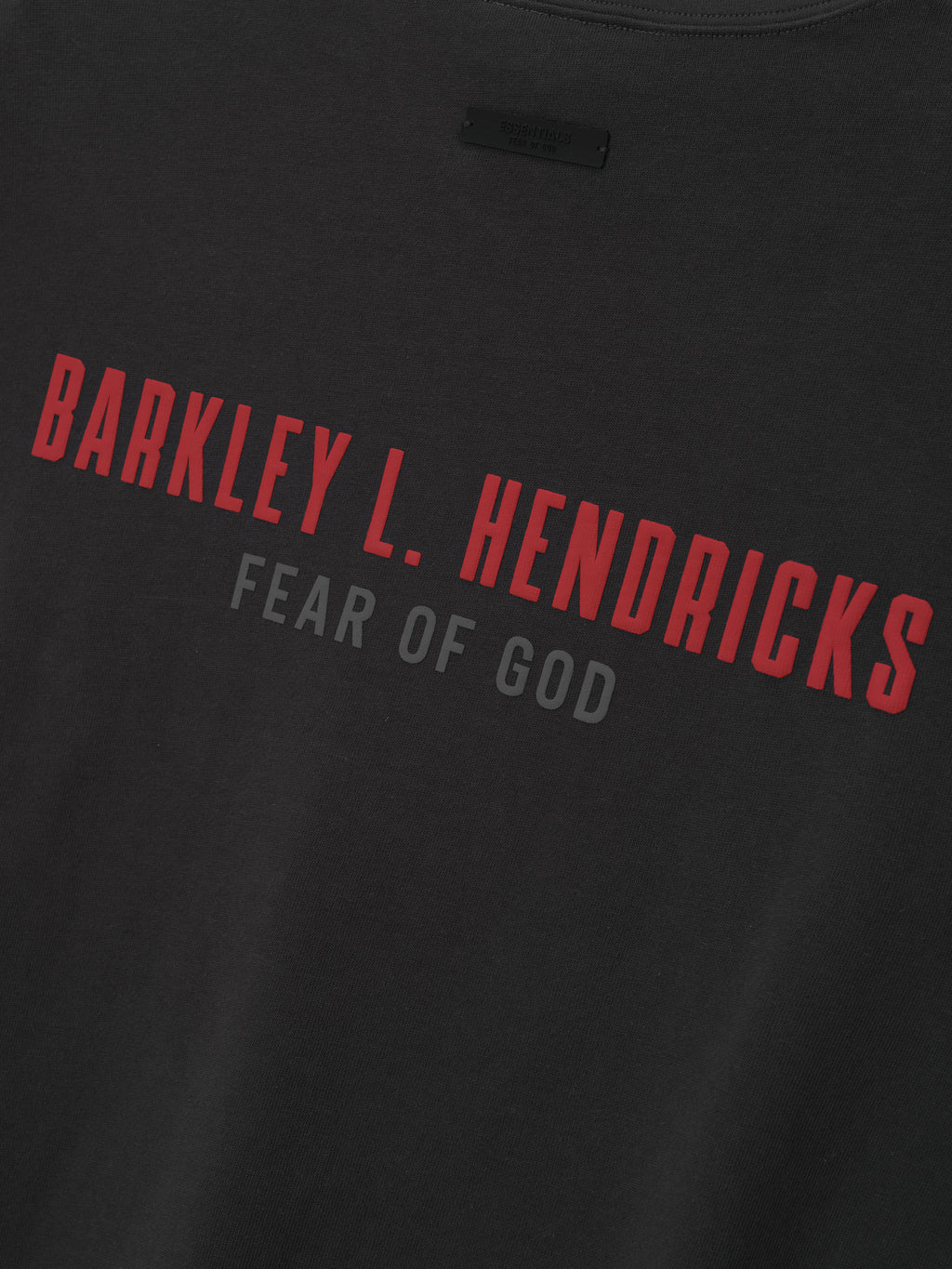 black heavy cotton jersey fabric with red Barkley L. Hendricks text and subtle gray Fear of God logo beneath