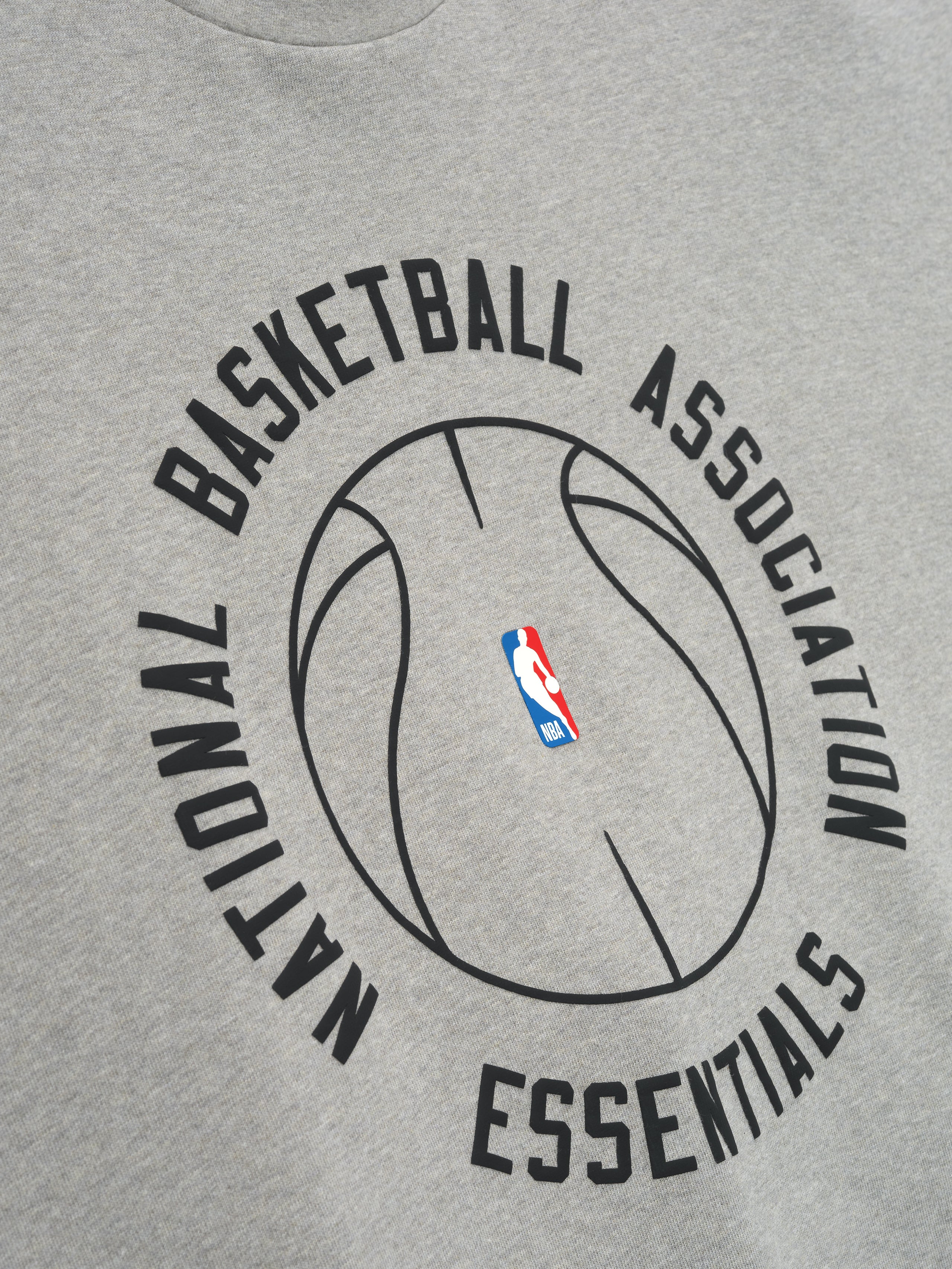 light grey heavyweight cotton jersey tee with large black NBA basketball outline and Essentials text on front