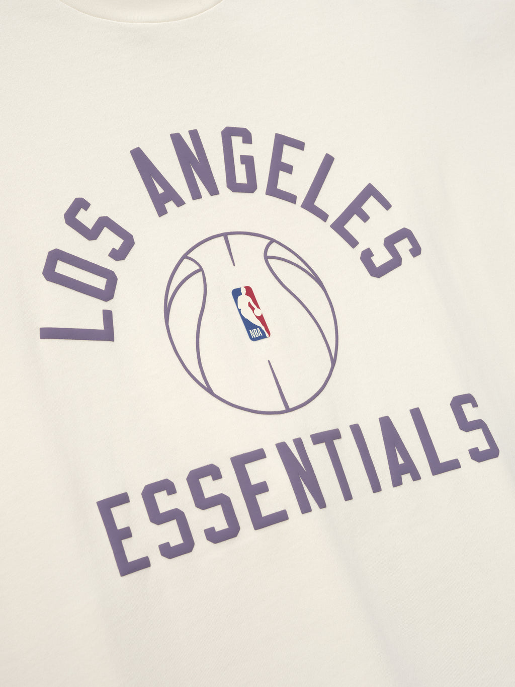 off-white heavyweight cotton jersey tee with purple Los Angeles Essentials text and NBA basketball graphic center front