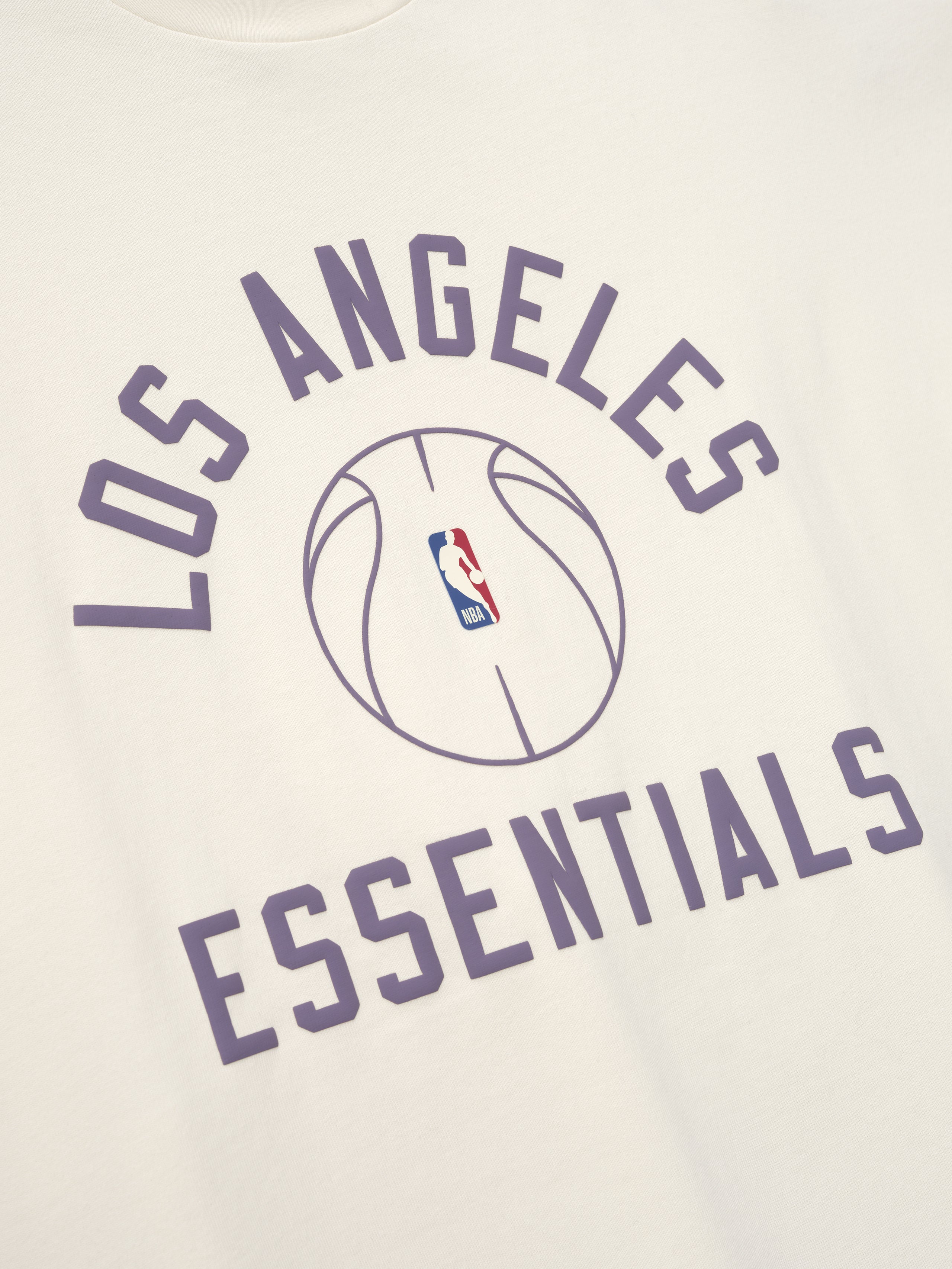 off-white heavyweight cotton jersey tee with purple Los Angeles Essentials text and NBA basketball graphic center front