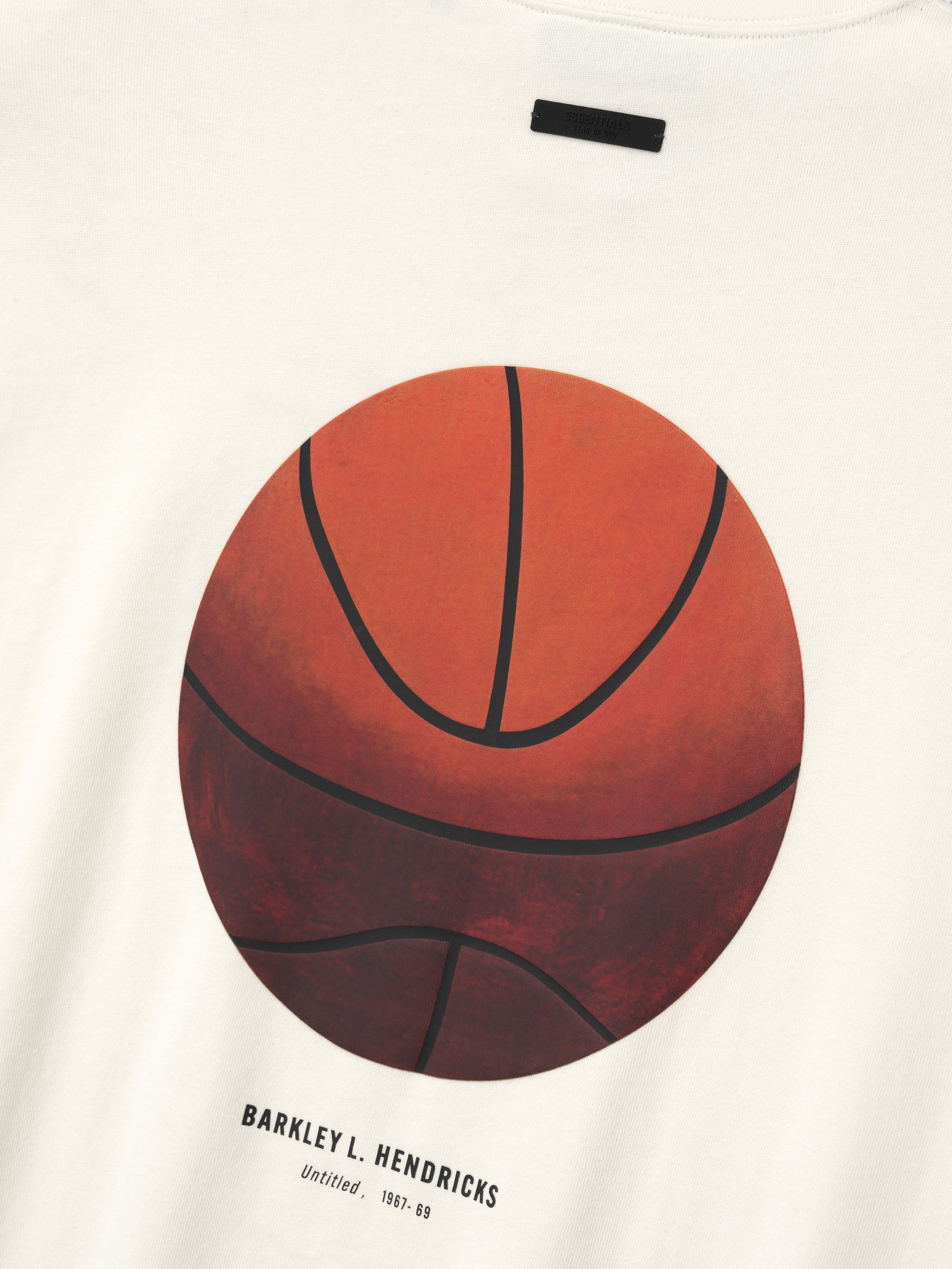 off-white cotton tee featuring large vintage-style basketball graphic with Barkley L. Hendricks text below center chest