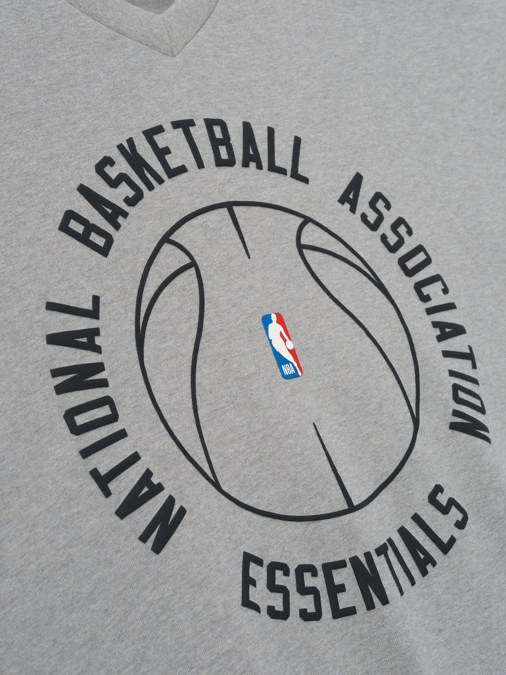 grey heavy cotton long sleeve V-neck tee with minimalist NBA Essentials basketball outline graphic center chest