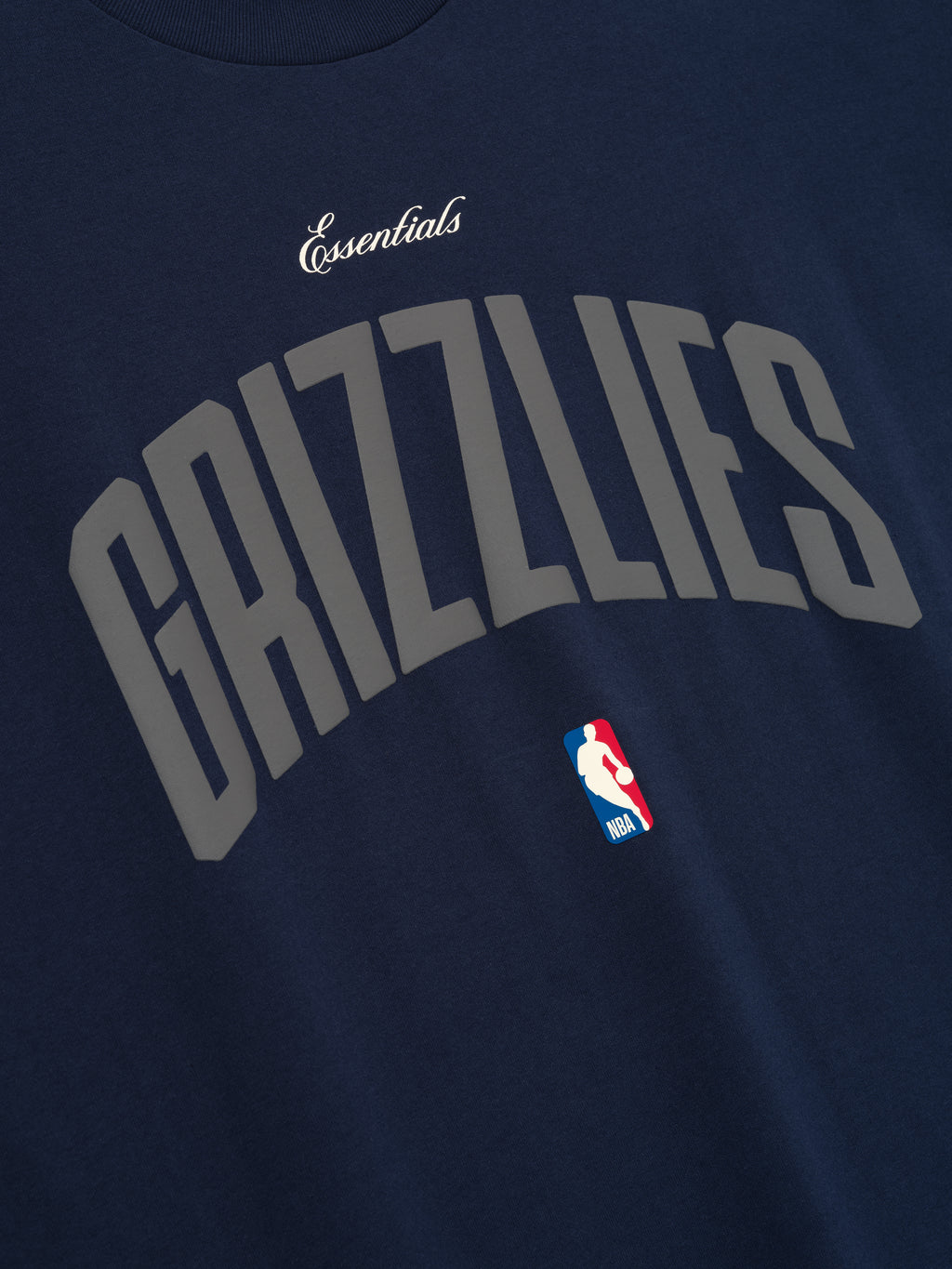 Close-up of midnight navy Memphis Grizzlies 90'S Fit Tee featuring curved grey Grizzlies text and NBA logo, gallery image 0.