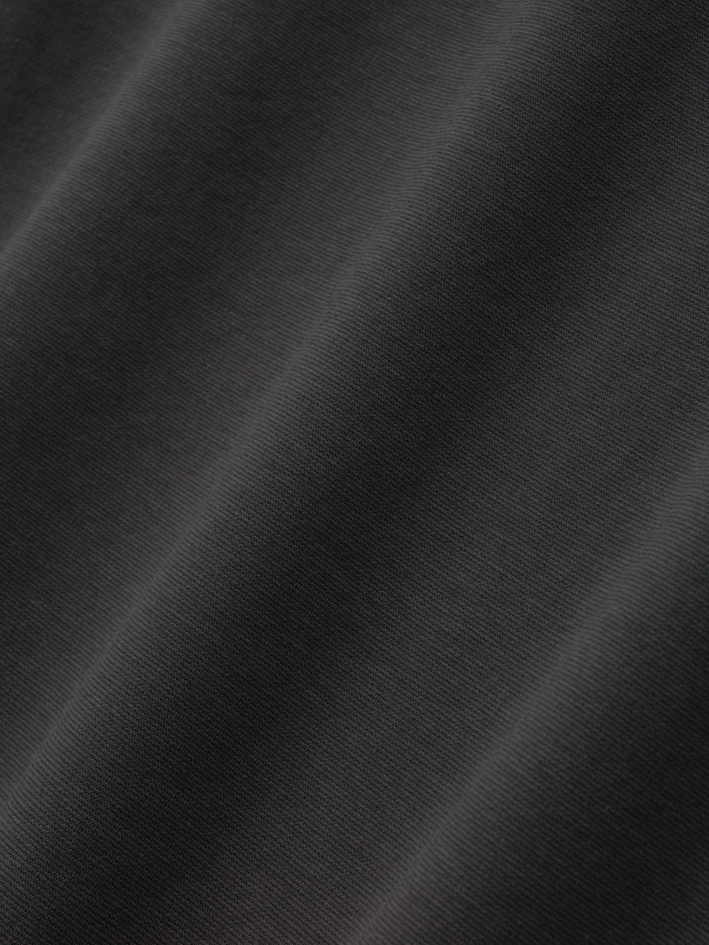 Close-up texture of iron grey Ponte 90s Tee fabric highlighting smooth, soft knit weave in first gallery image