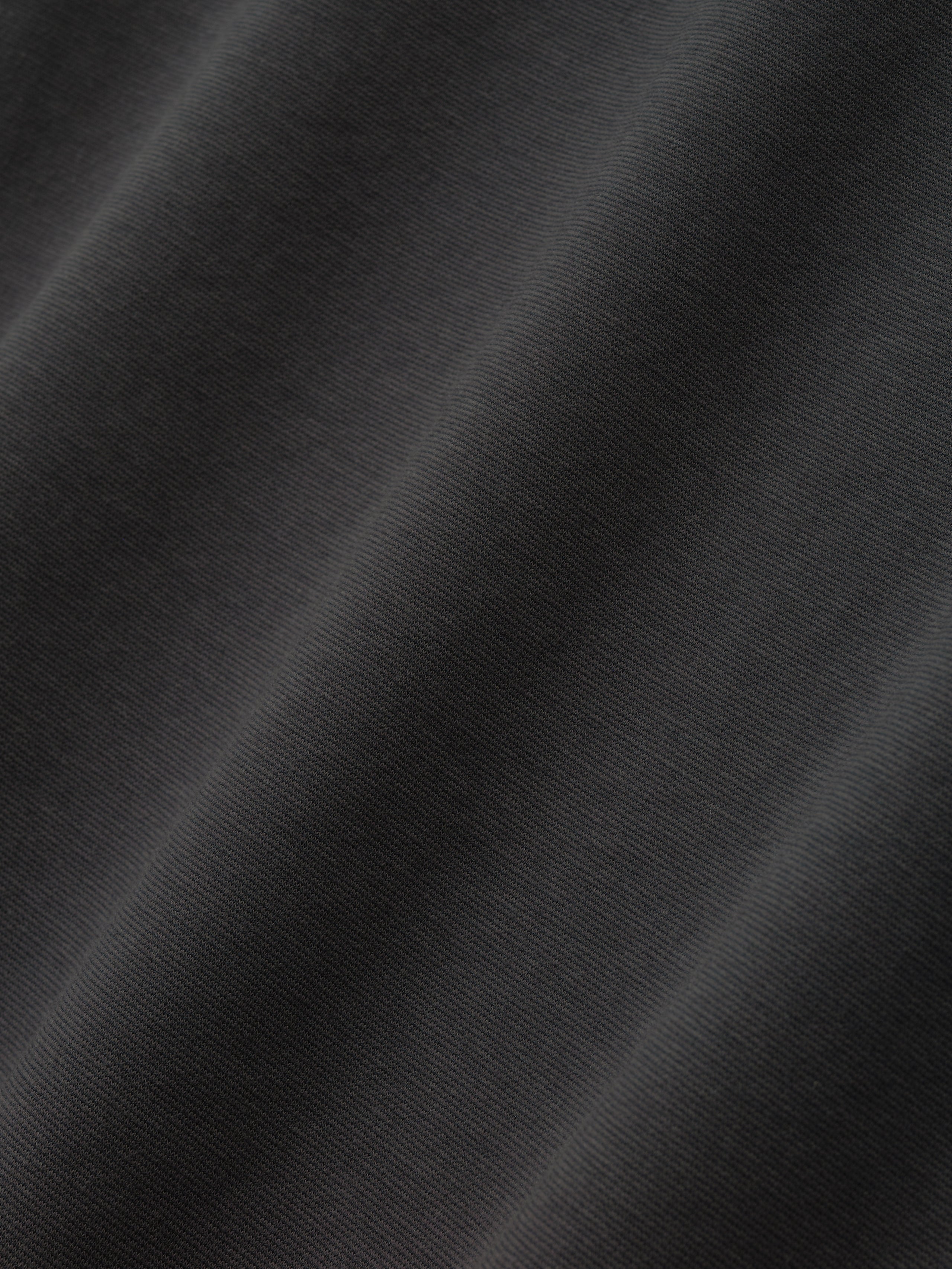 Close-up texture of iron grey Ponte 90s Tee fabric highlighting smooth, soft knit weave in first gallery image