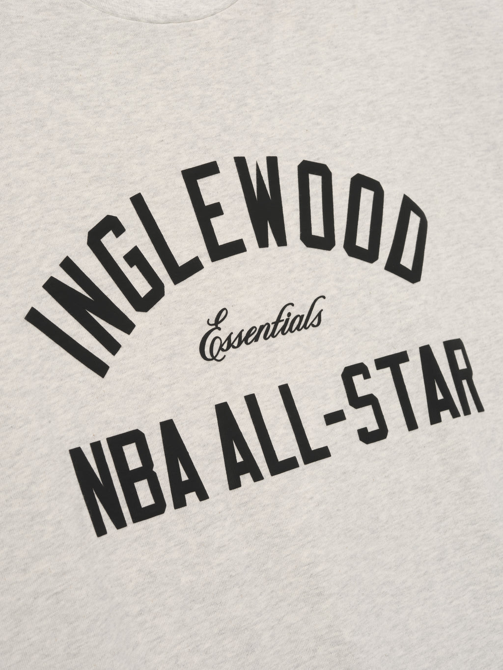 light beige cotton tee with bold Inglewood NBA All-Star arched text and Essentials script center chest design