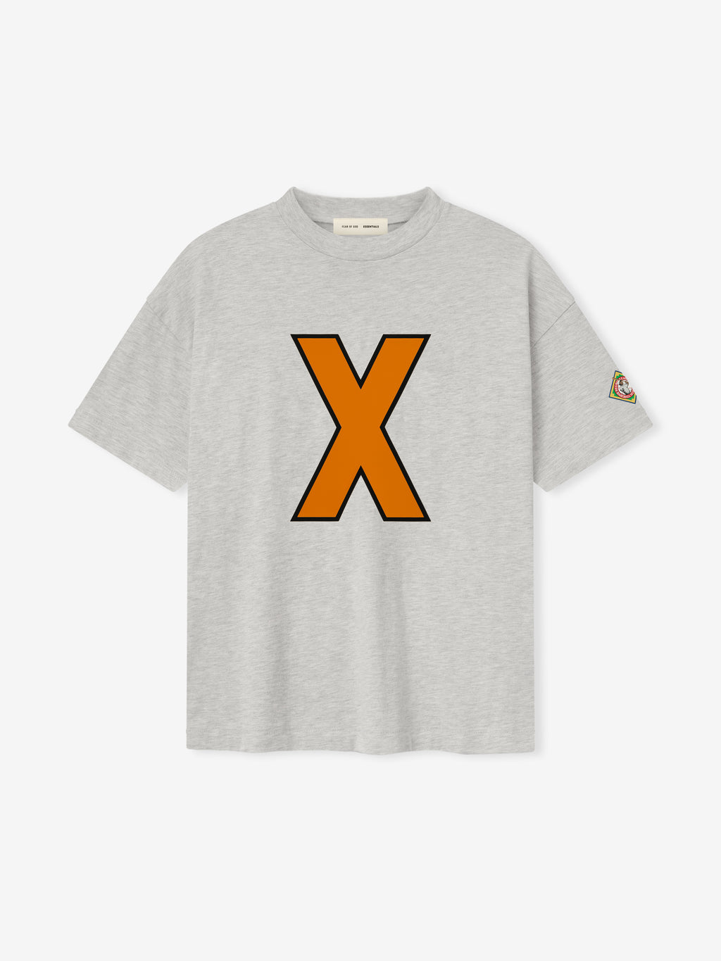 light gray cotton tee with large orange "X" outlined in black on front and small multicolored patch on sleeve