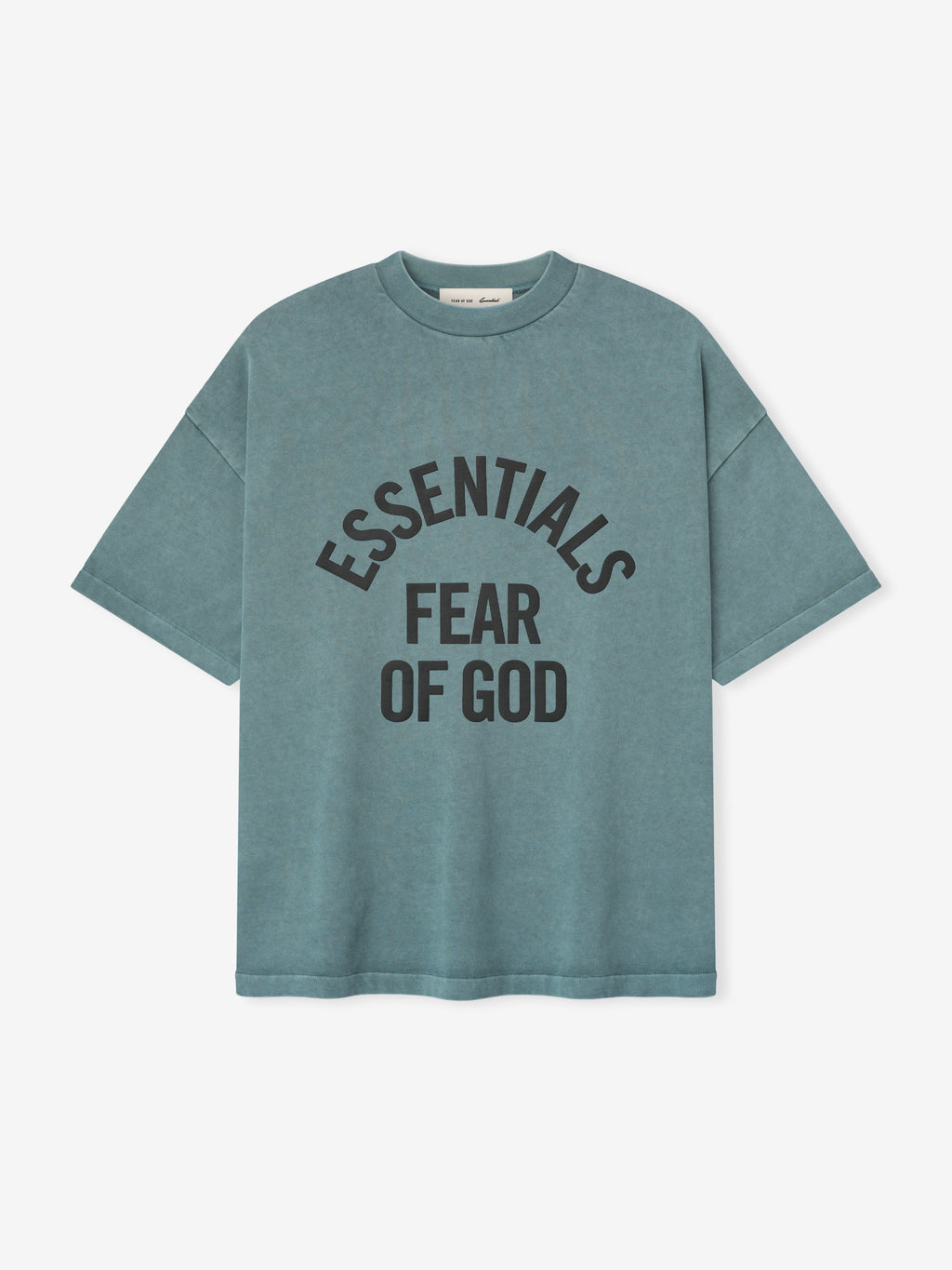 pigment-dyed heavyweight cotton crewneck tee in faded blue with bold "ESSENTIALS FEAR OF GOD" text curved on front