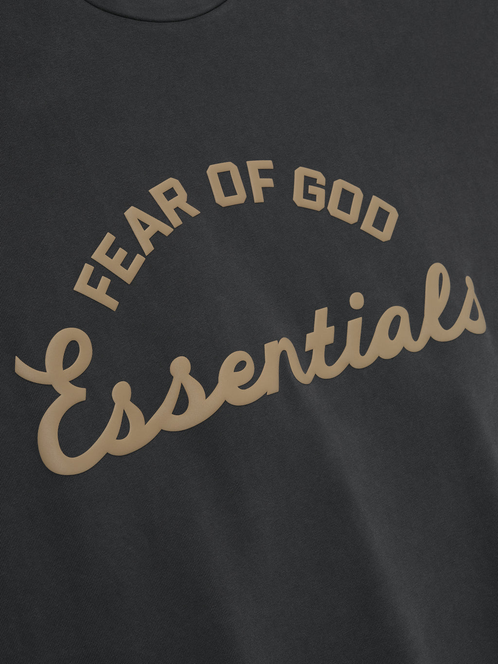 close-up of vintage black pigment-dyed 90s fit tee with Fear of God Essentials arched logo print in tan
