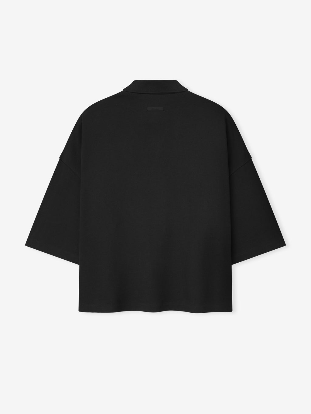 back view of black medium-weight cotton poly pique cropped polo with oversized 90s fit and 3/4 sleeves