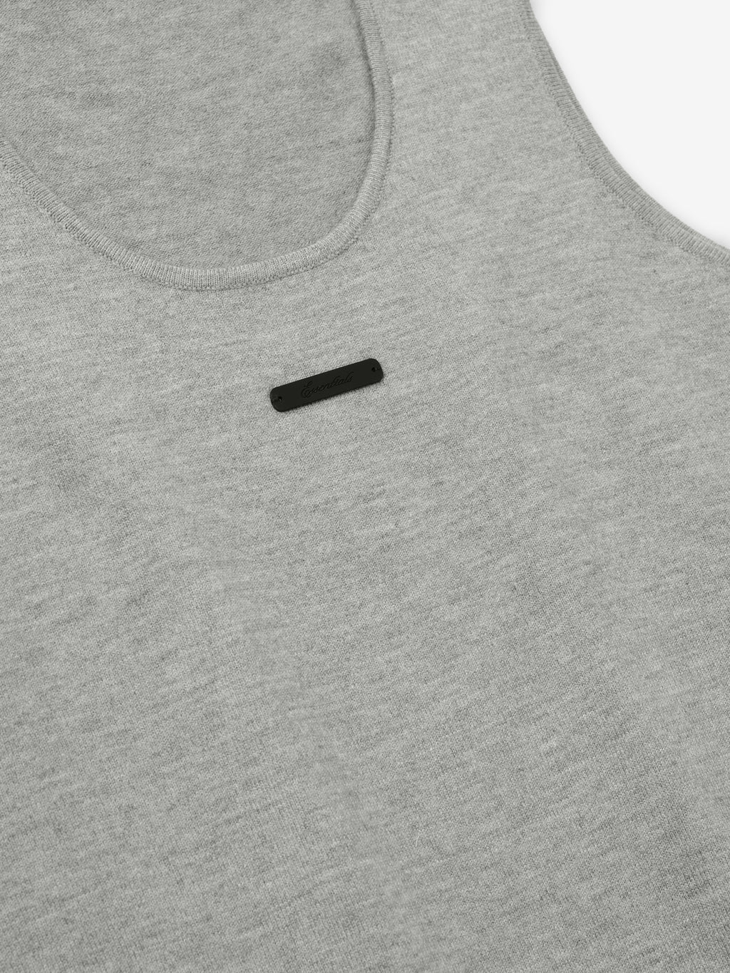 close-up of women's grey rib-knit tank top with scoop neckline and small black logo detail on chest