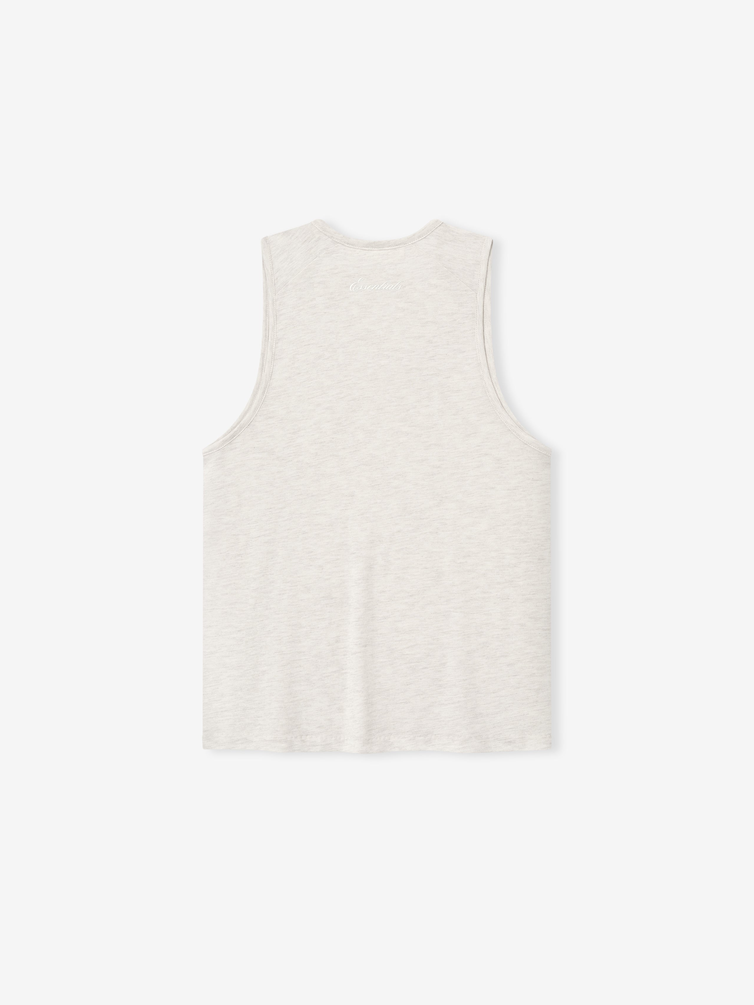 White sleeveless top on a light beige background