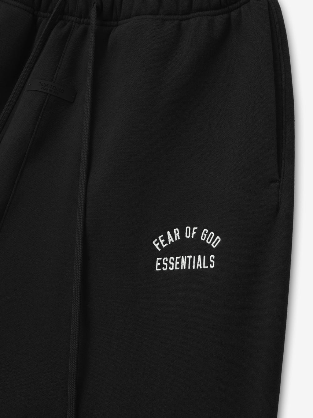 black relaxed fit sweatpant with embroidered Fear of God Essentials logo on thigh and elastic waistband detail