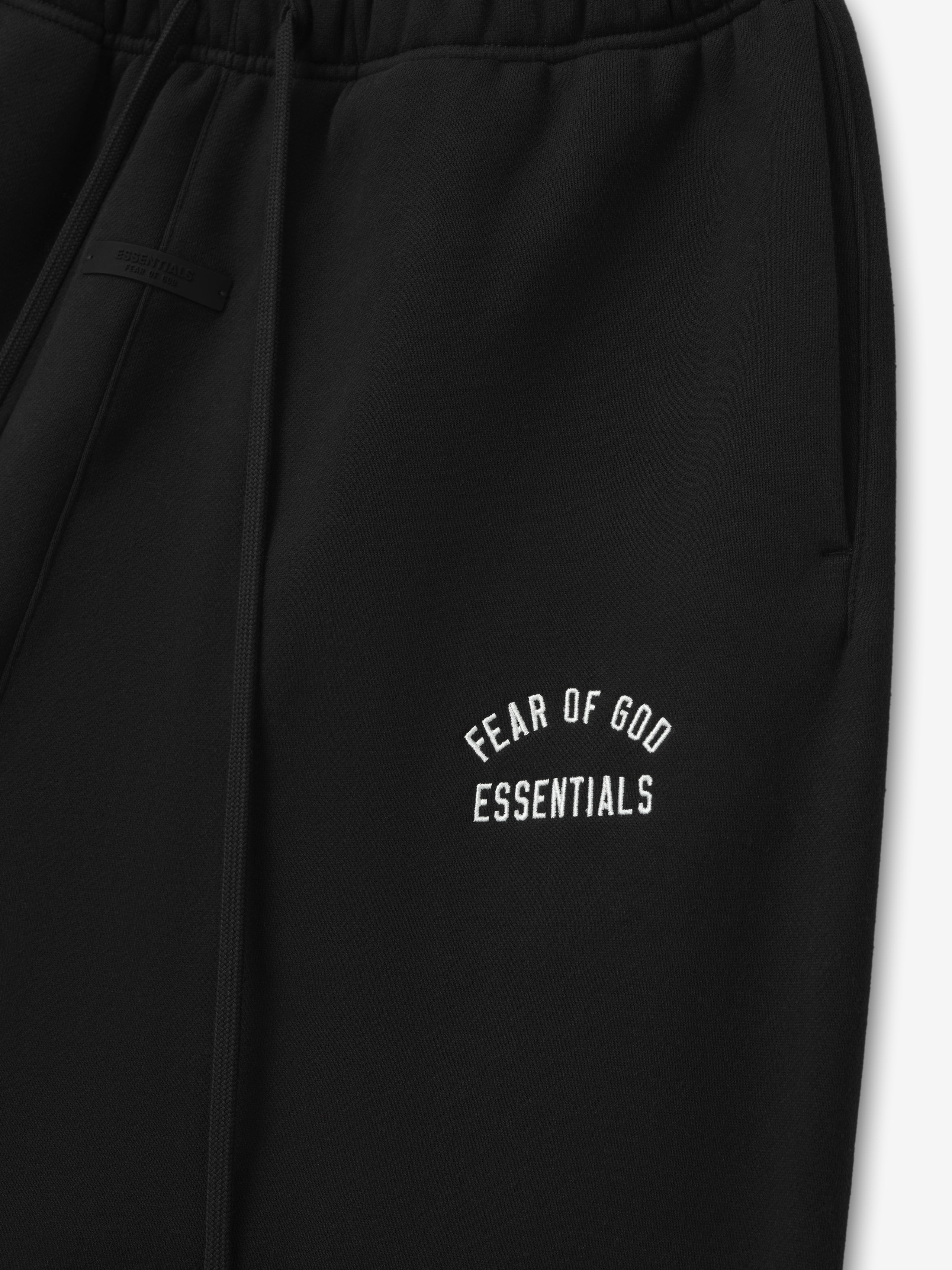 black relaxed fit sweatpant with embroidered Fear of God Essentials logo on thigh and elastic waistband detail