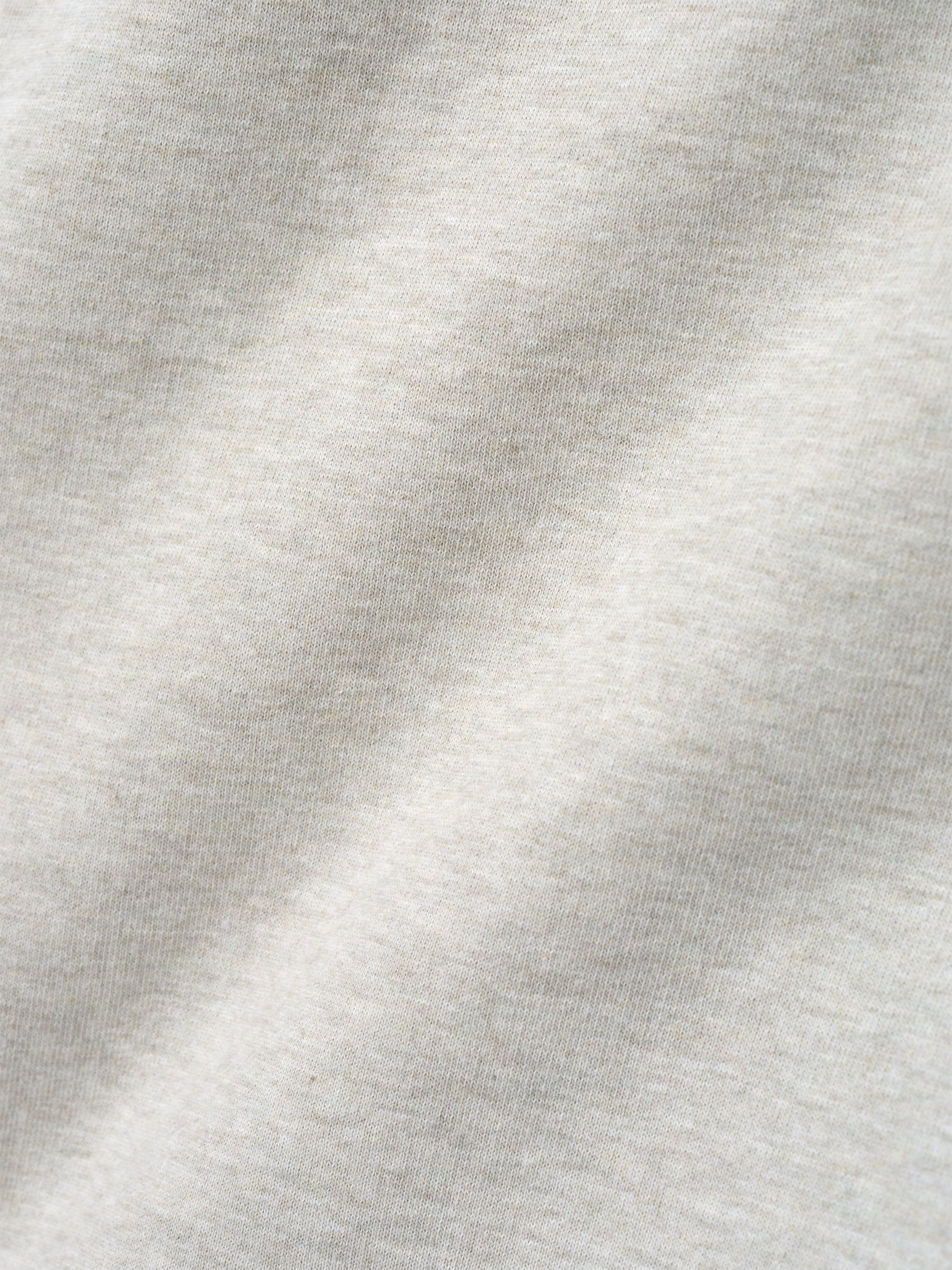 close-up of off-white heavyweight cotton fleece fabric with textured surface and soft appearance from NBA x Barkley Hendricks sweatpant