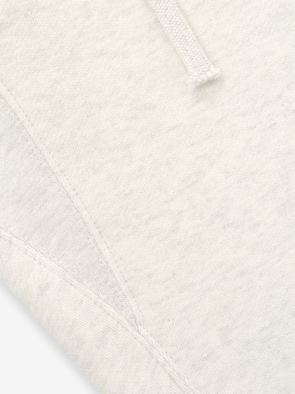 Close-up of a textured white fabric with a diamond pattern