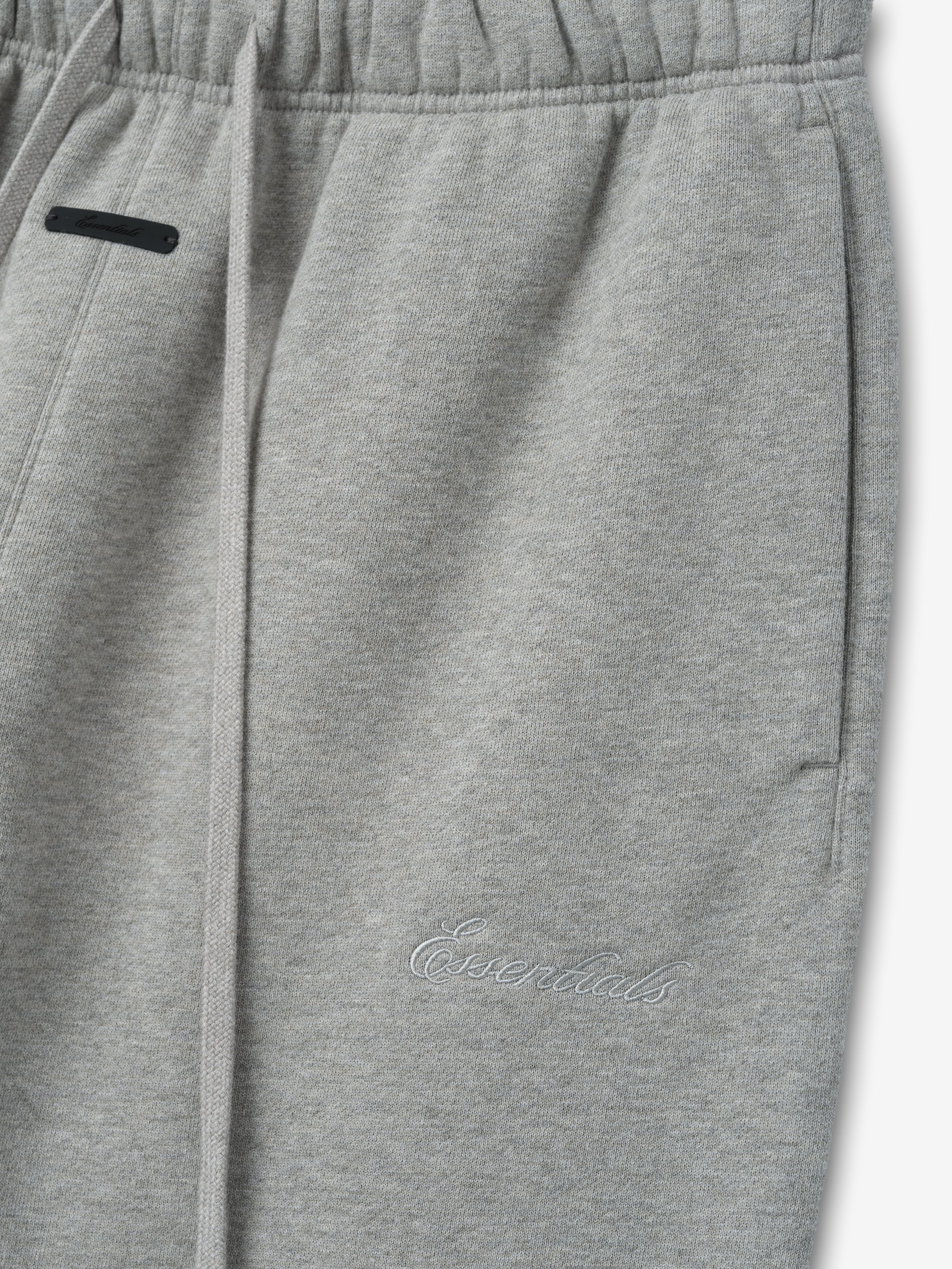 Gray sweatpants with a brand logo on a white background