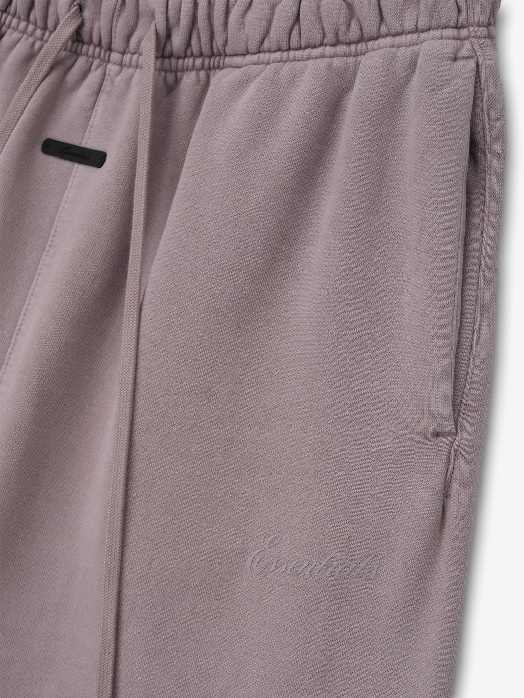 Womens Signature Classic Flare Sweatpant in a muted mauve shade featuring an elastic waistband with drawstrings, side pockets, and subtle tonal Essentials embroidery.