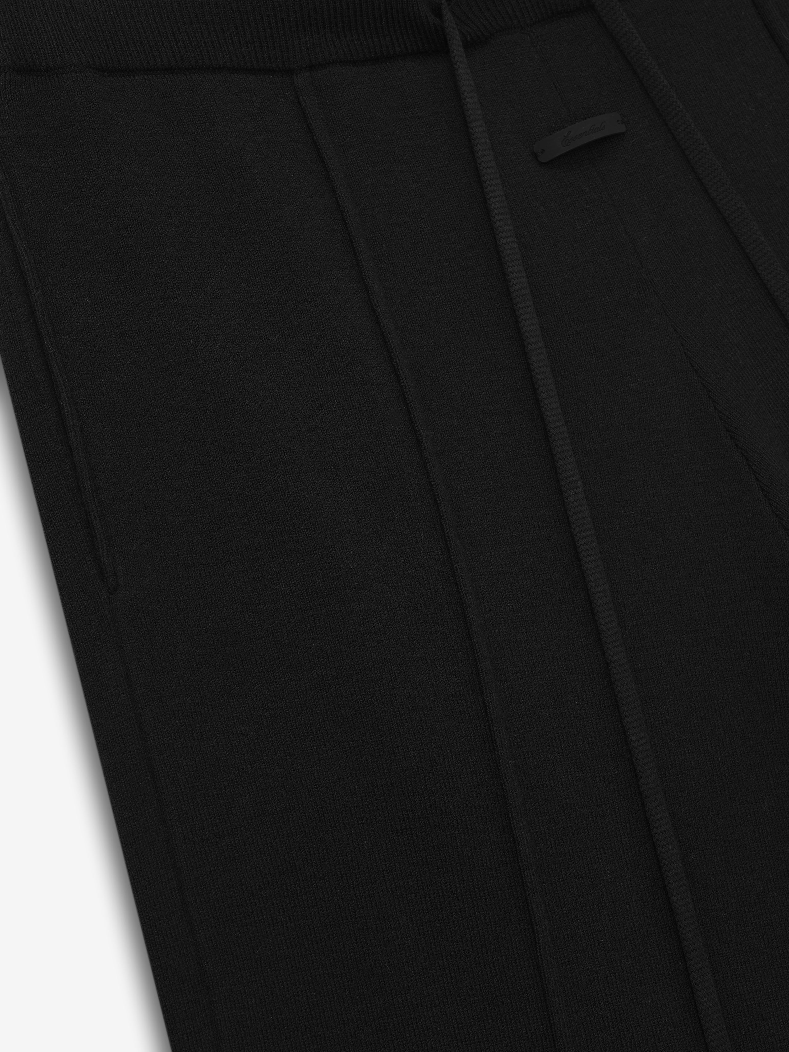 close-up of black women's relaxed lounge sweatpants in soft jersey knit with elastic waistband and drawstring detail
