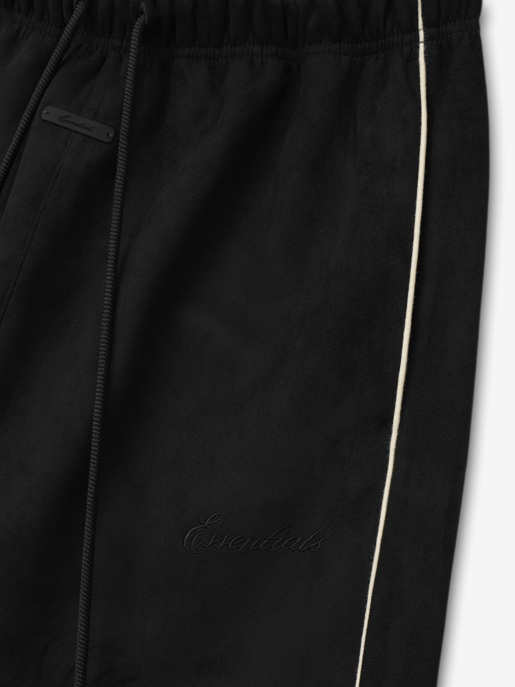 Black pants with a brand logo on a white background