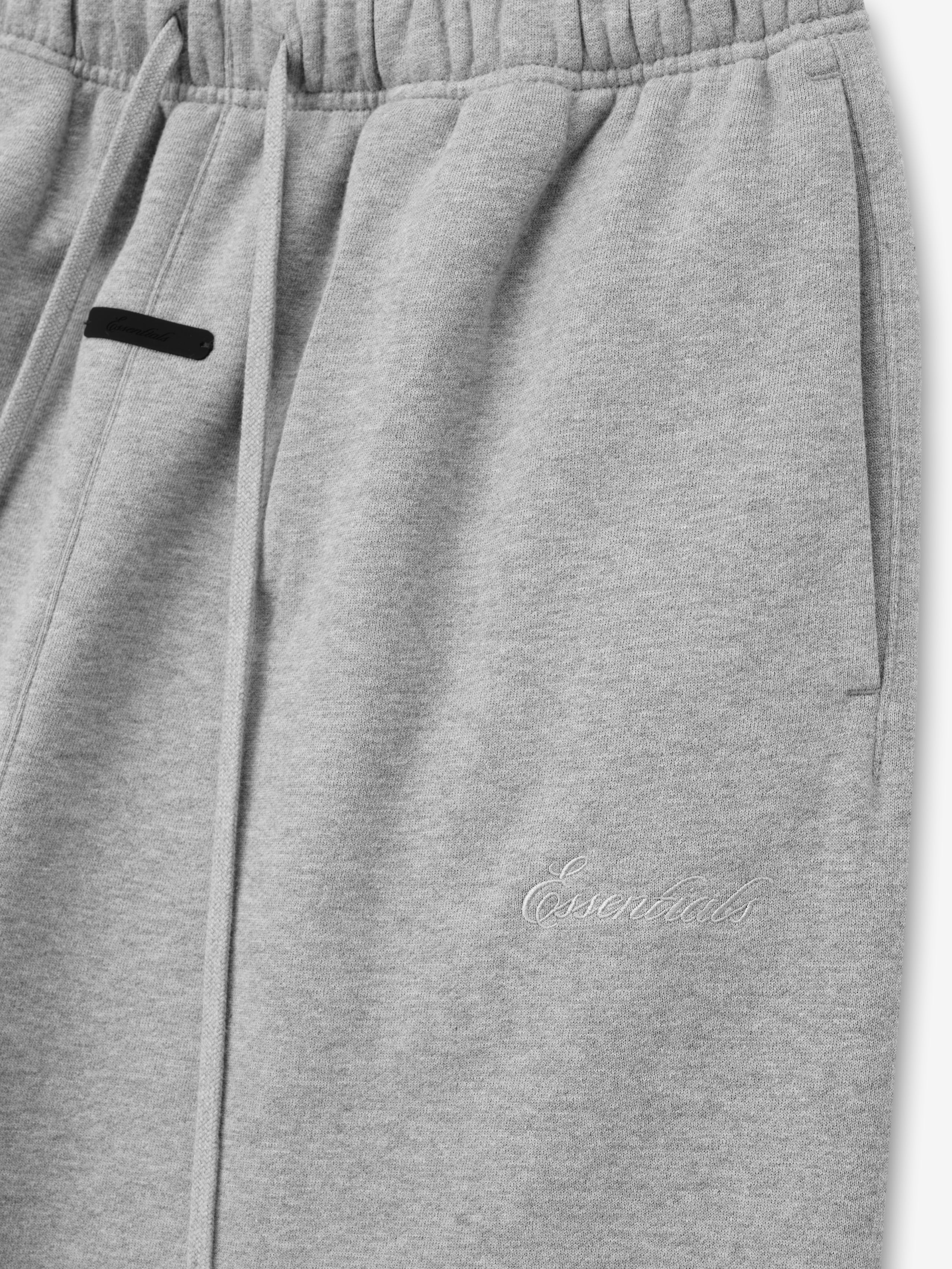 light grey signature classic fit flare sweatpants with elastic waistband and embroidered Essentials logo on leg