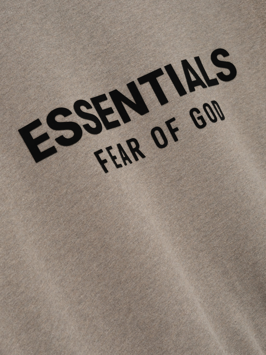 Close-up of Homestead Heather Classic Fit Fleece Crewneck with black Essentials Fear of God logo print
