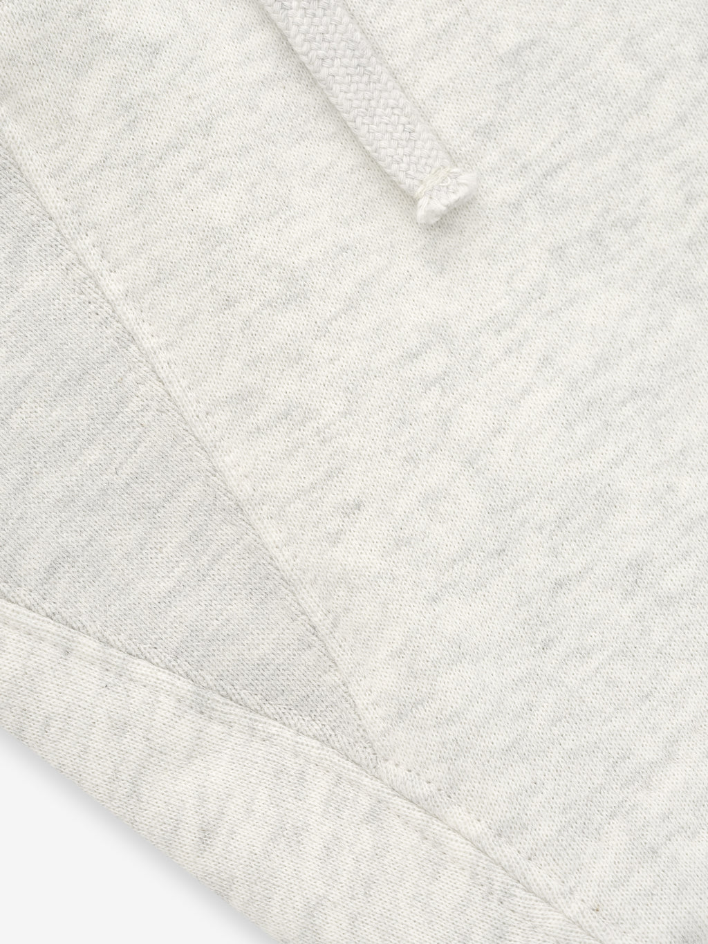 Close-up of a textured white fabric with a diamond pattern