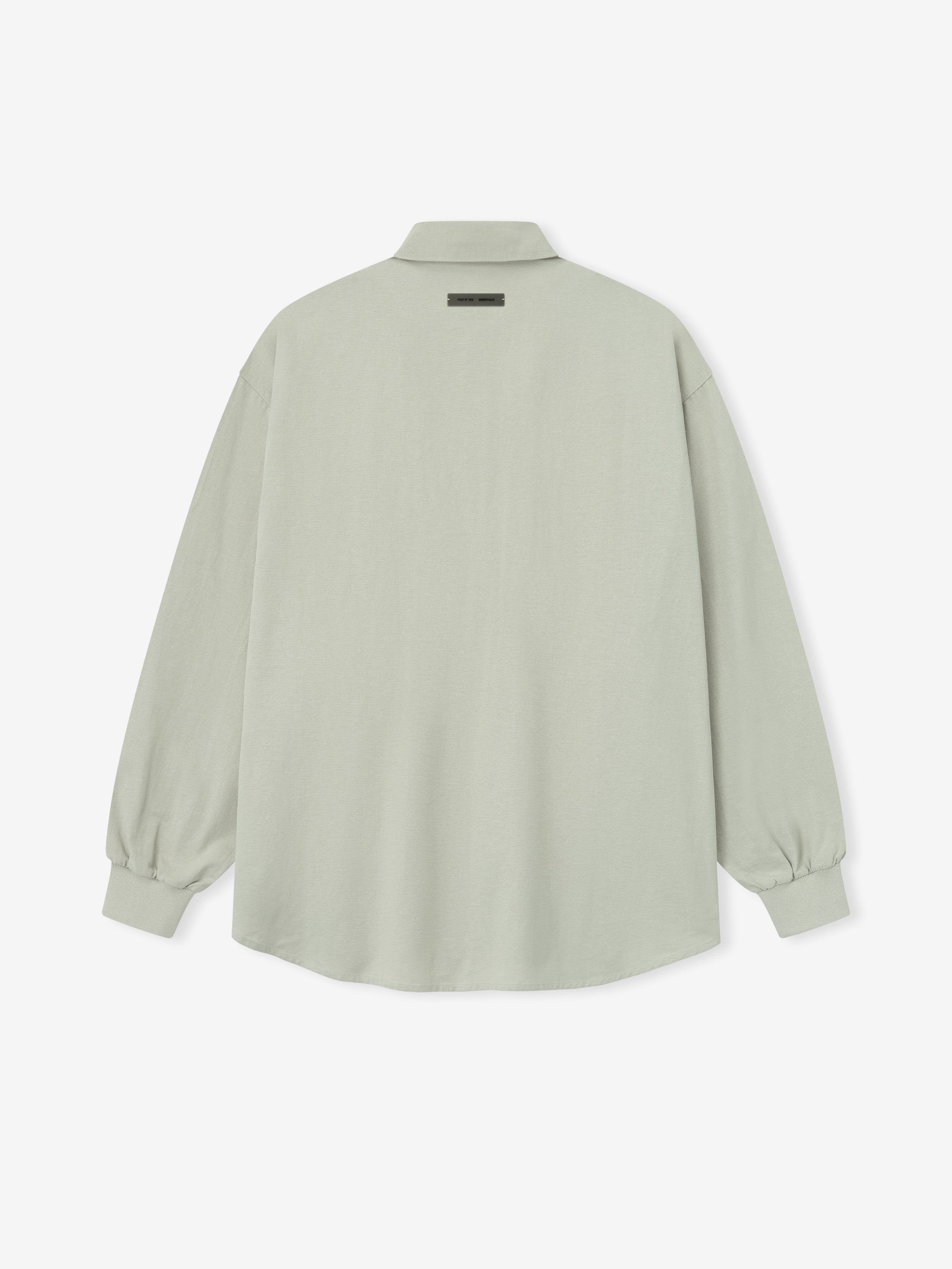back view of oversized light sage green Oxford shirt with long sleeves and elasticated cuffs on white background