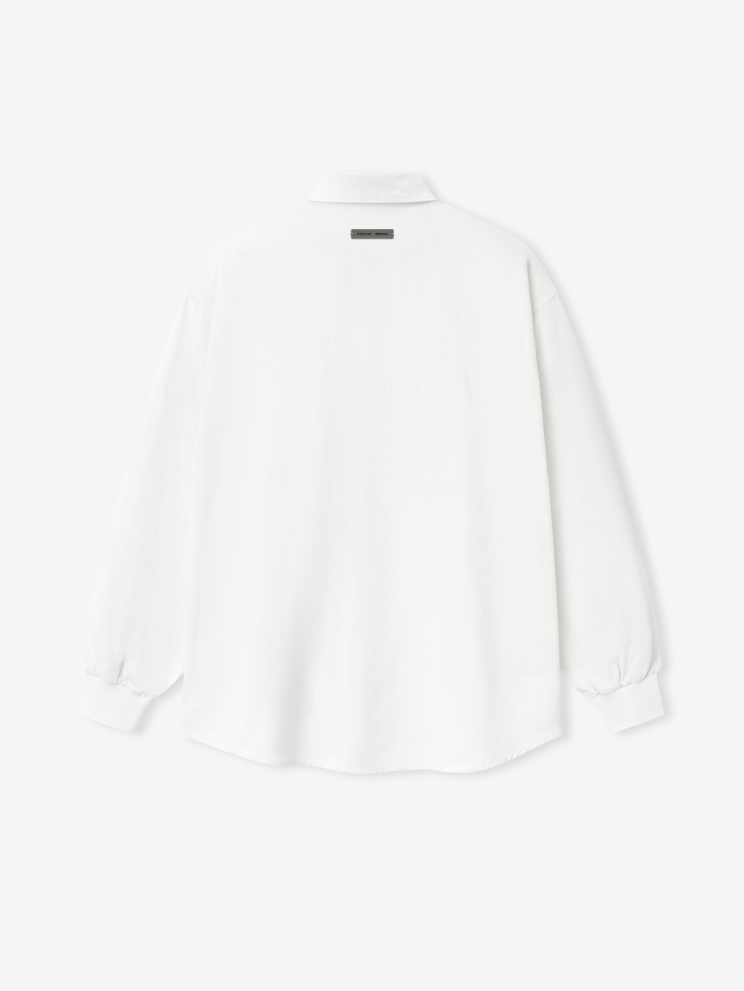 back view of oversized white cotton Oxford shirt with long sleeves and ribbed cuffs on plain background