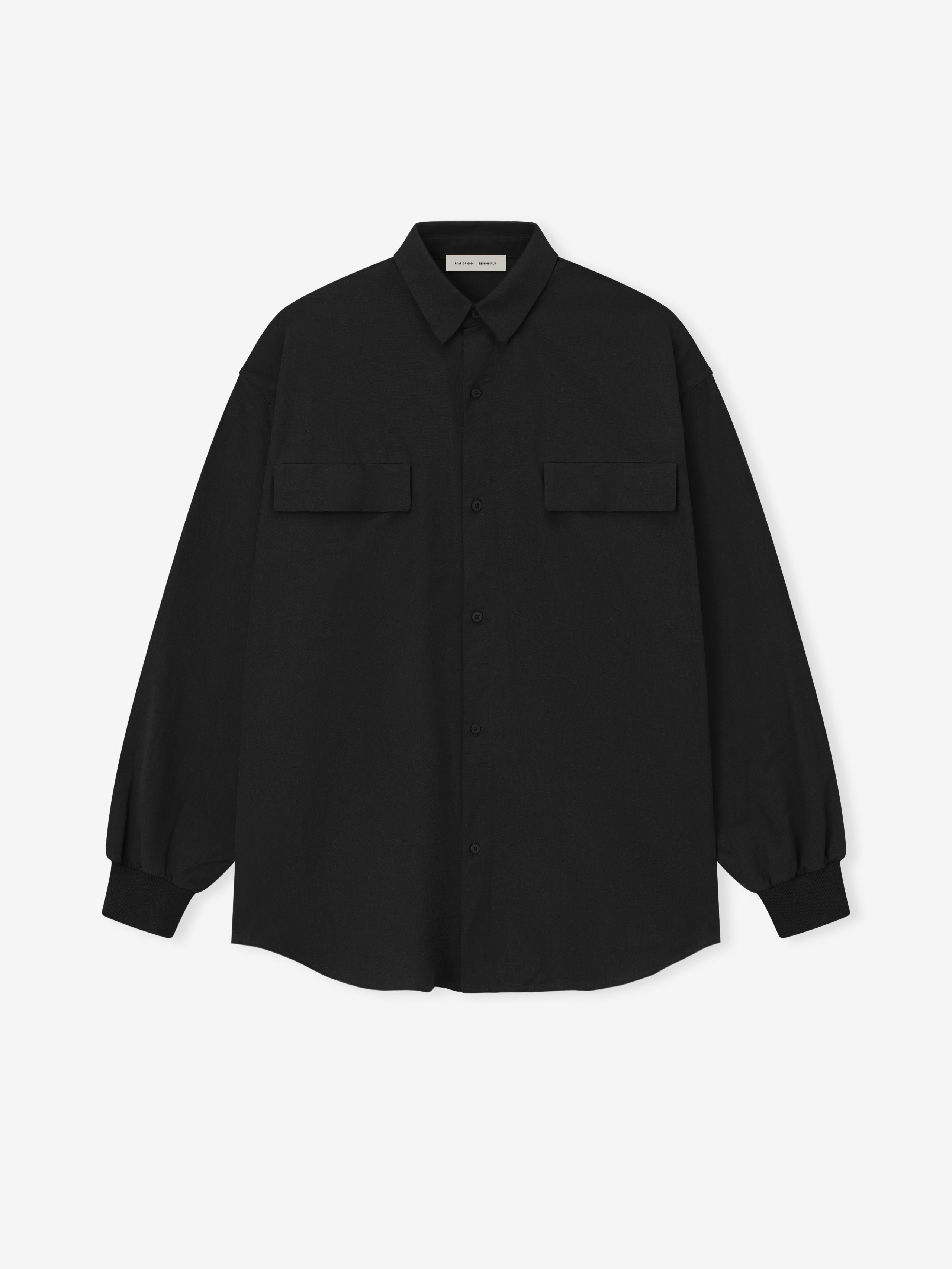 black oversized cotton Oxford shirt with long sleeves and flap pockets laid flat on white background