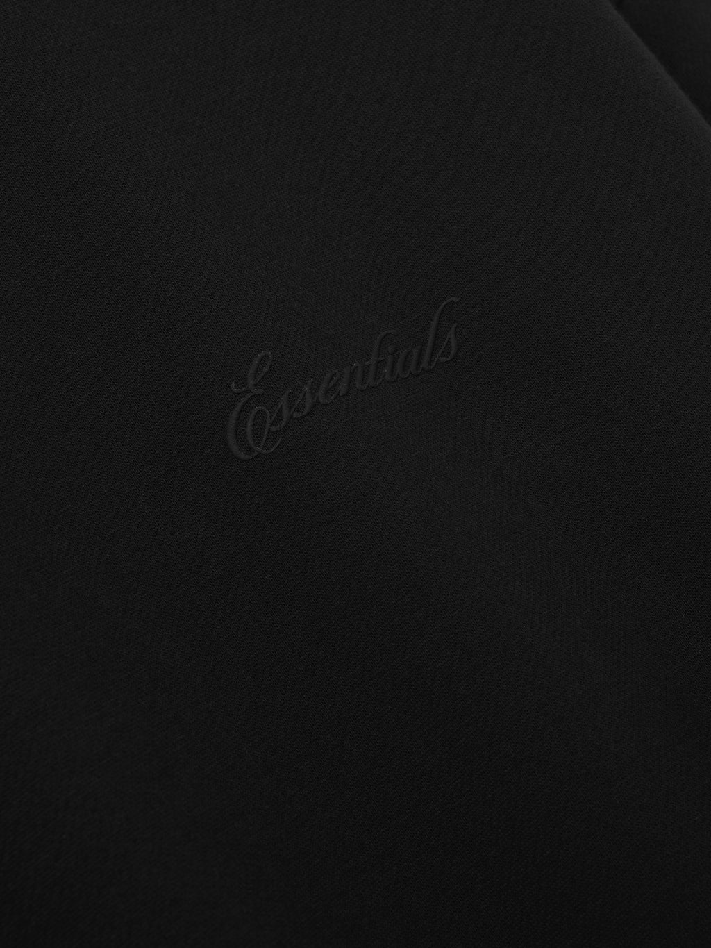 Black sweater with 'Essentials' signature logo