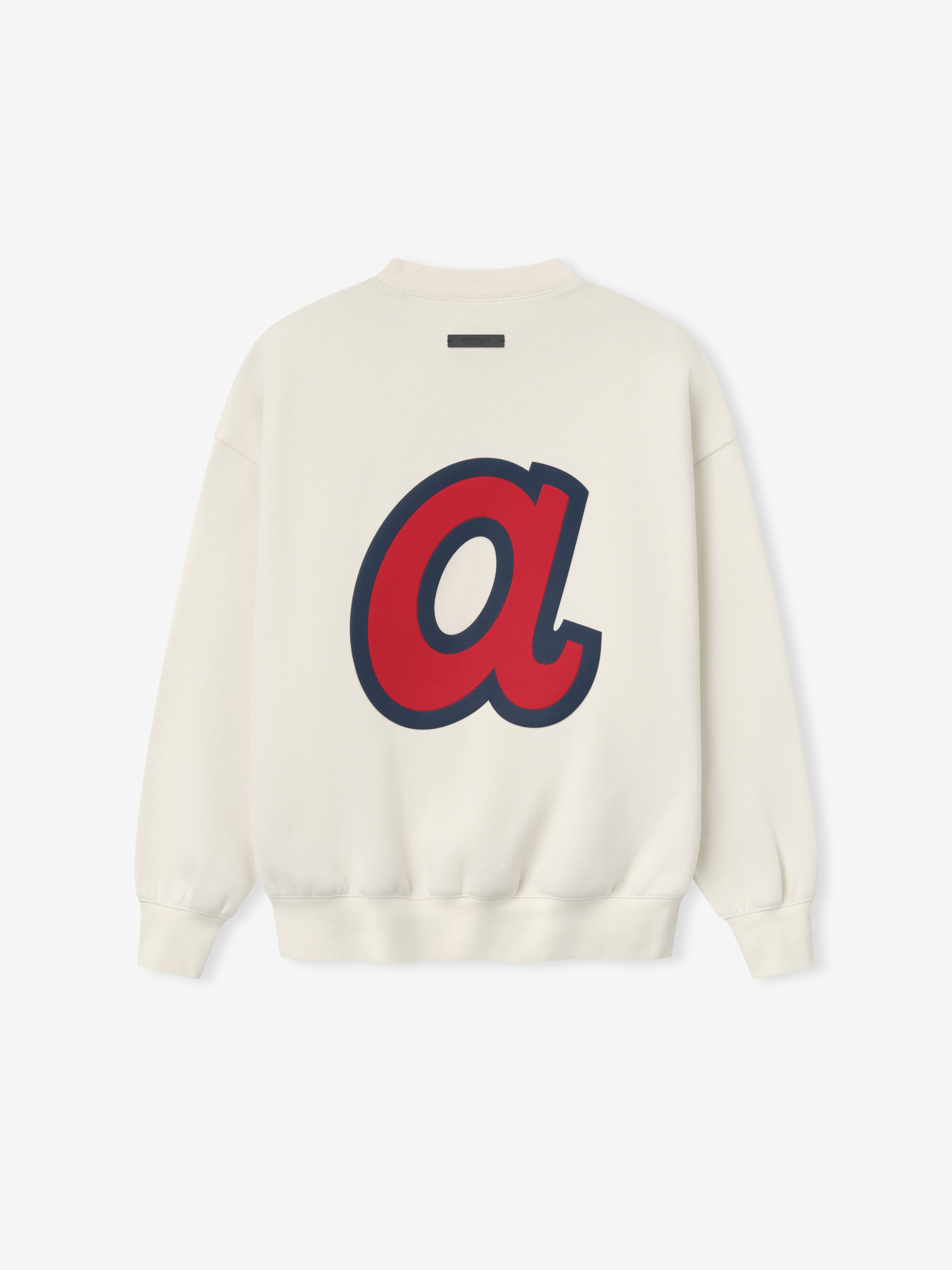 Off-white crewneck sweatshirt showing large red lowercase "a" outlined in navy centered on back fabric