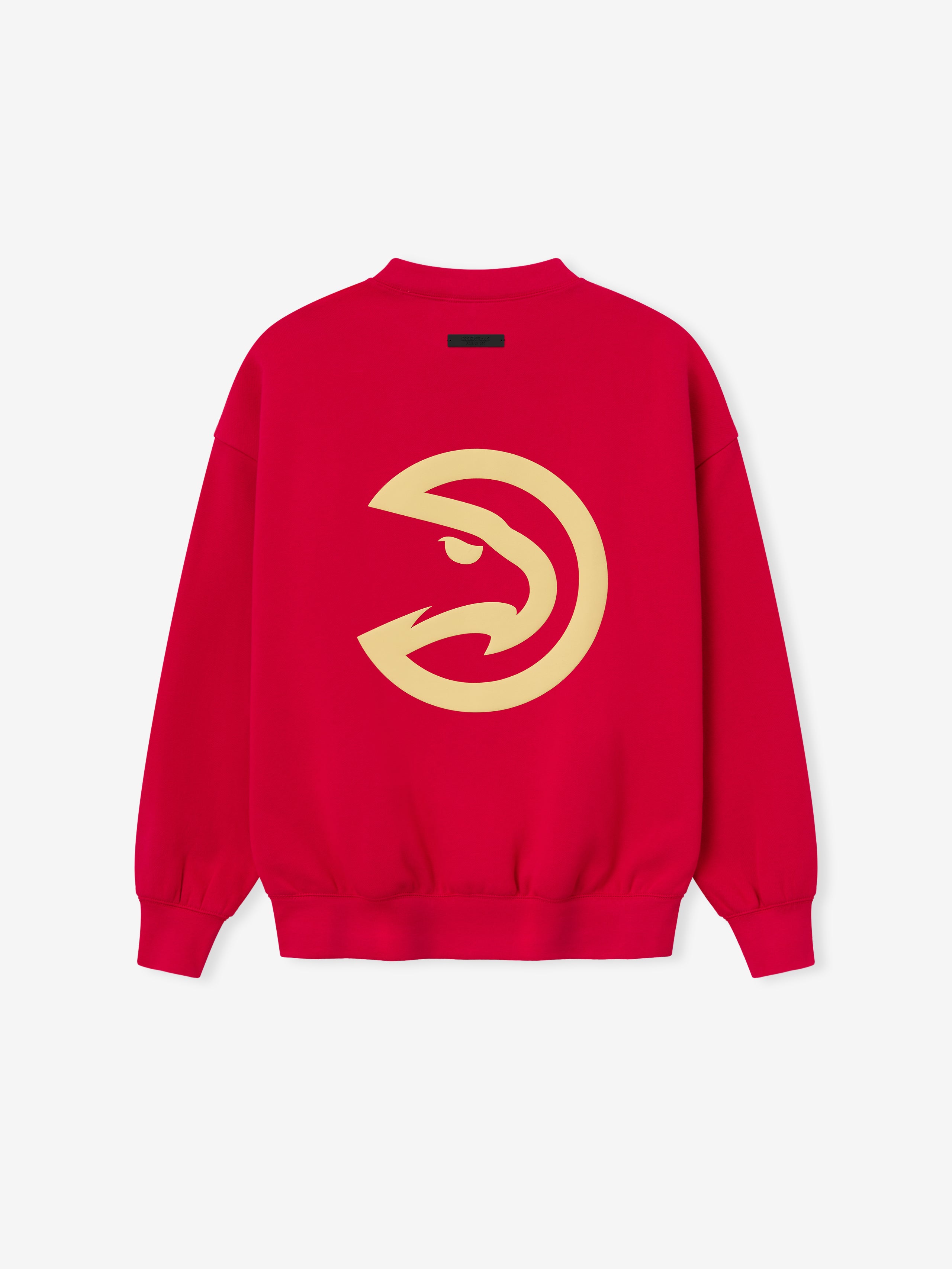 Back view of red crewneck sweatshirt displaying large beige stylized hawk logo centered on fabric