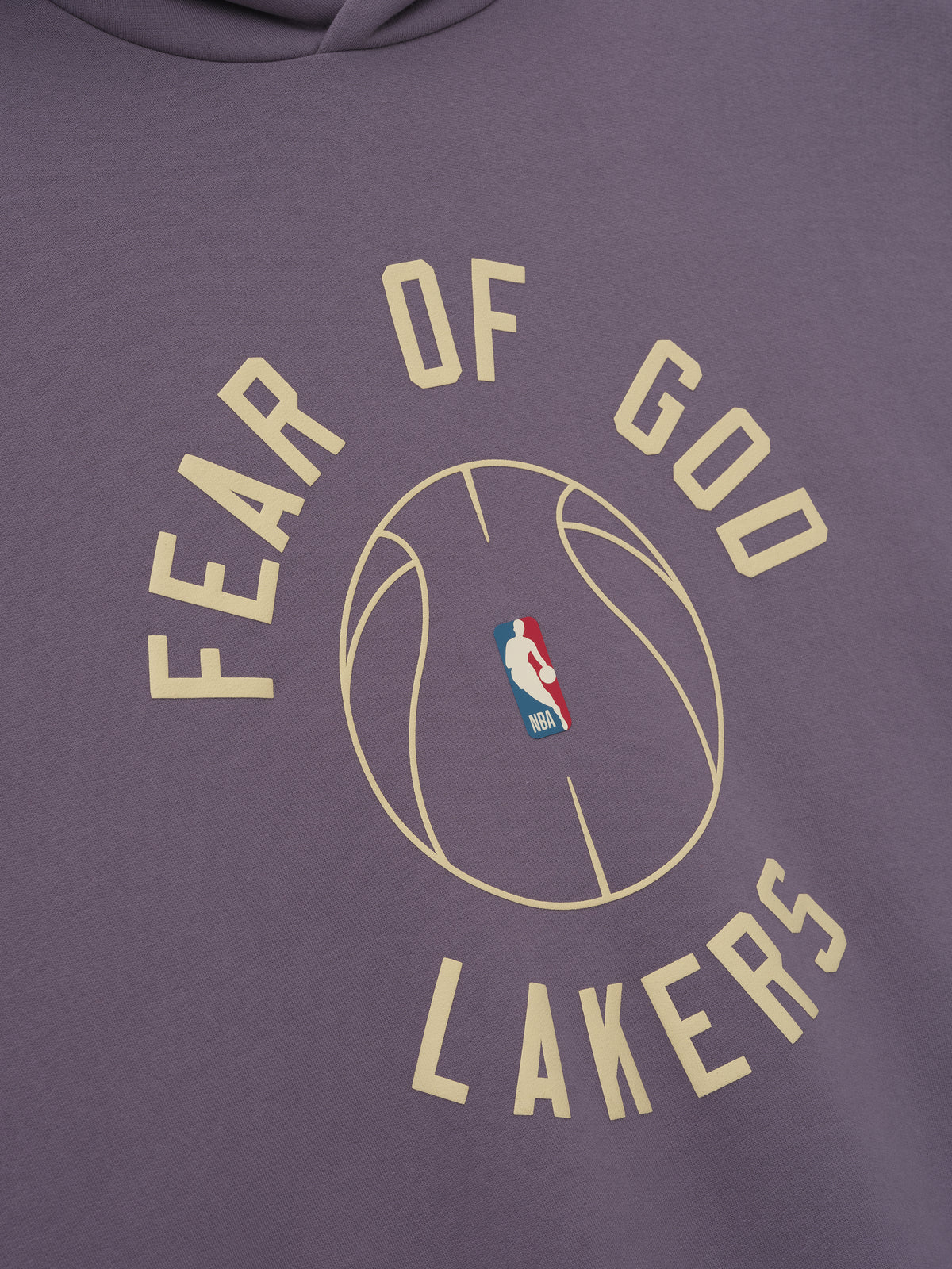 close-up of dusty purple hoodie with puff-printed "FEAR OF GOD LAKERS" text and NBA basketball graphic on front