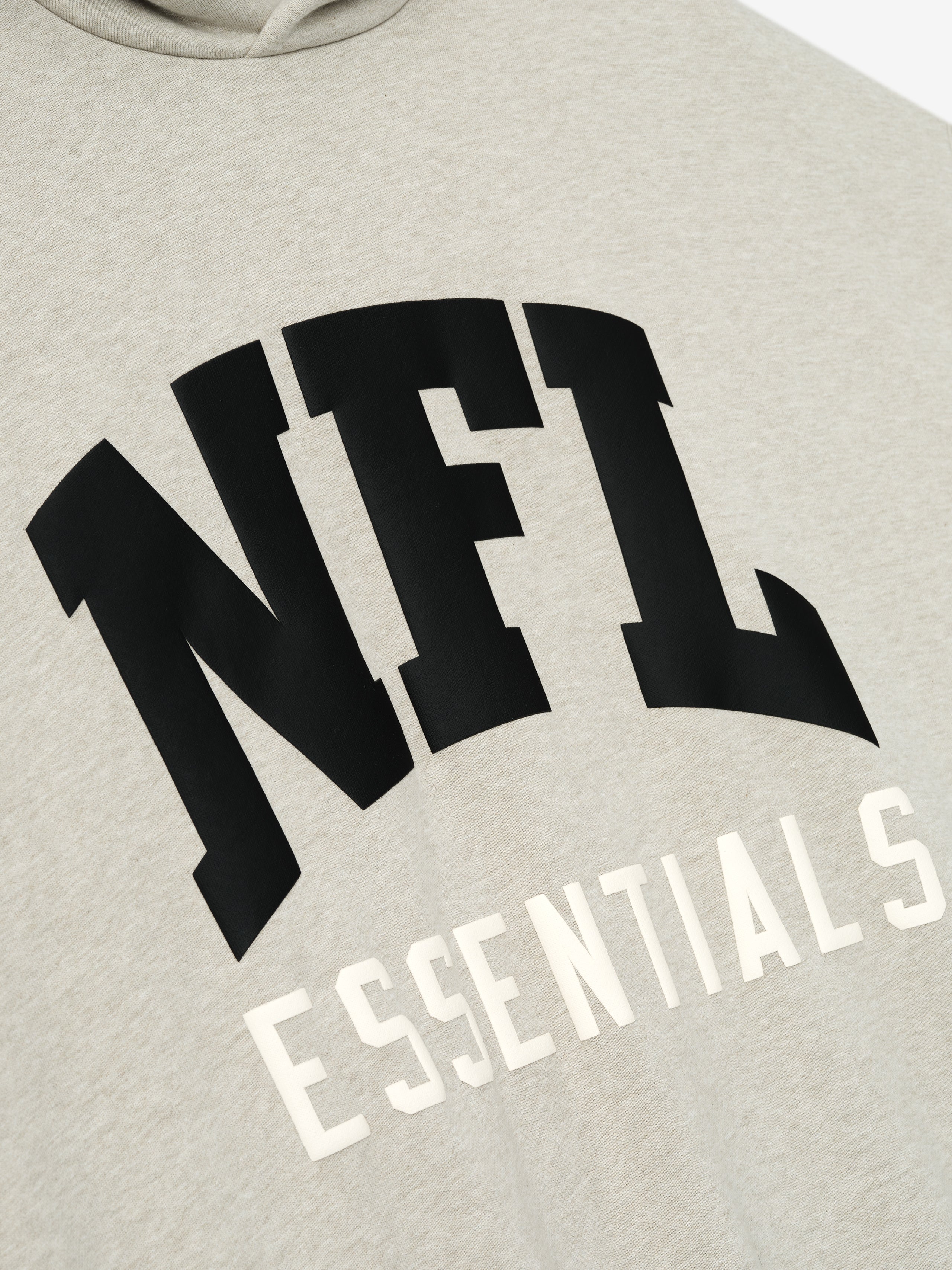 Heather stone NFL Sport Hoodie close-up showing bold black NFL lettering and white Essentials text, gallery image 0