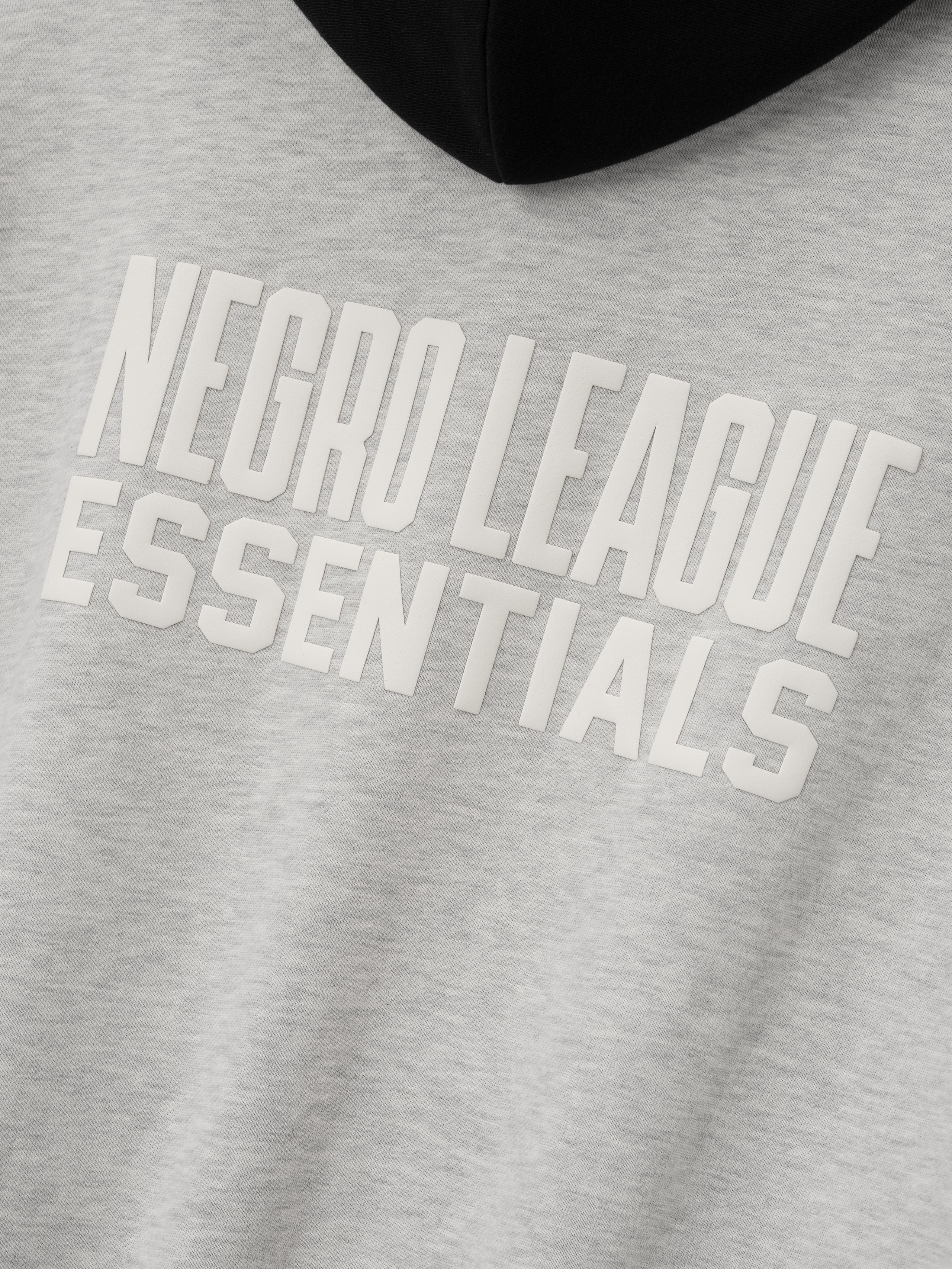 light gray hoodie front with raised white "NEGRO LEAGUE ESSENTIALS" text printed on fleece fabric