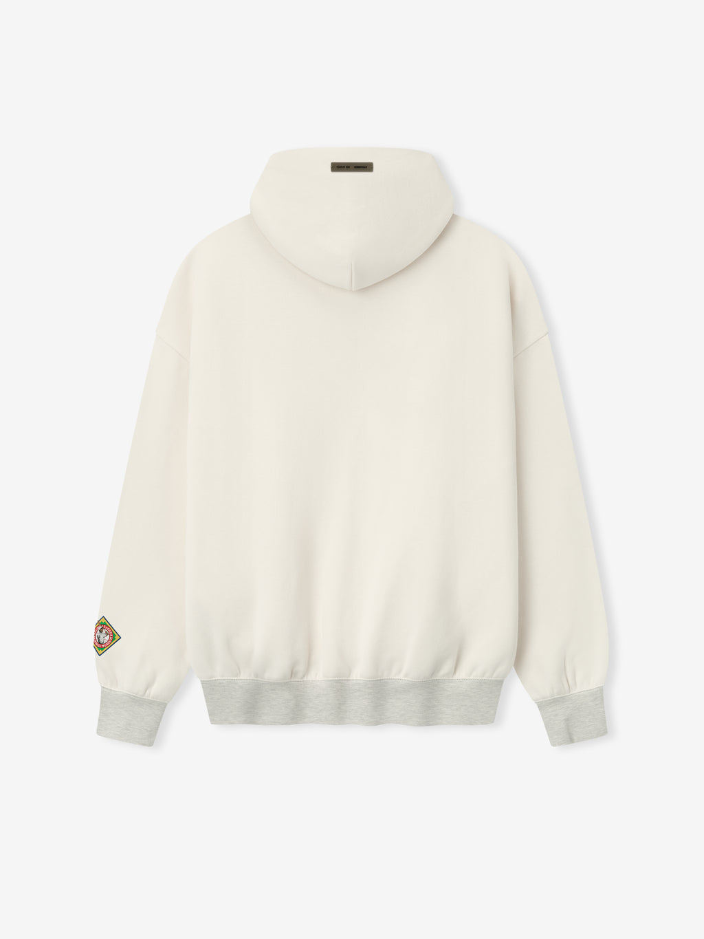 off-white cropped hoodie back with gray ribbed hem and multicolored patch detail on left sleeve cuff