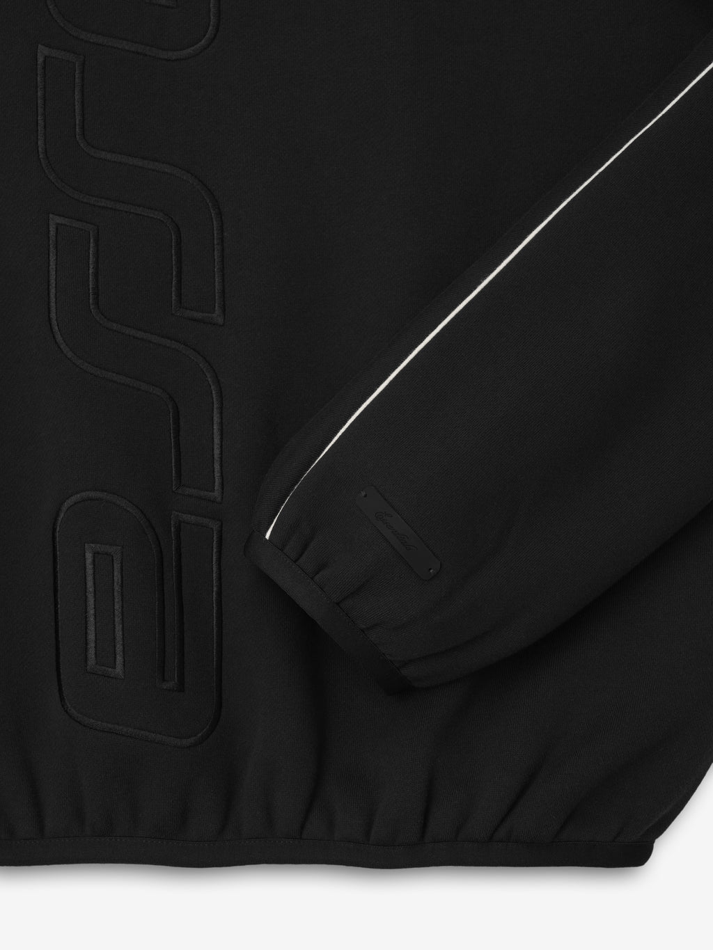 black fleece crewneck with embossed vertical Essentials logo and reflective piping detail on sleeve cuff and side panel