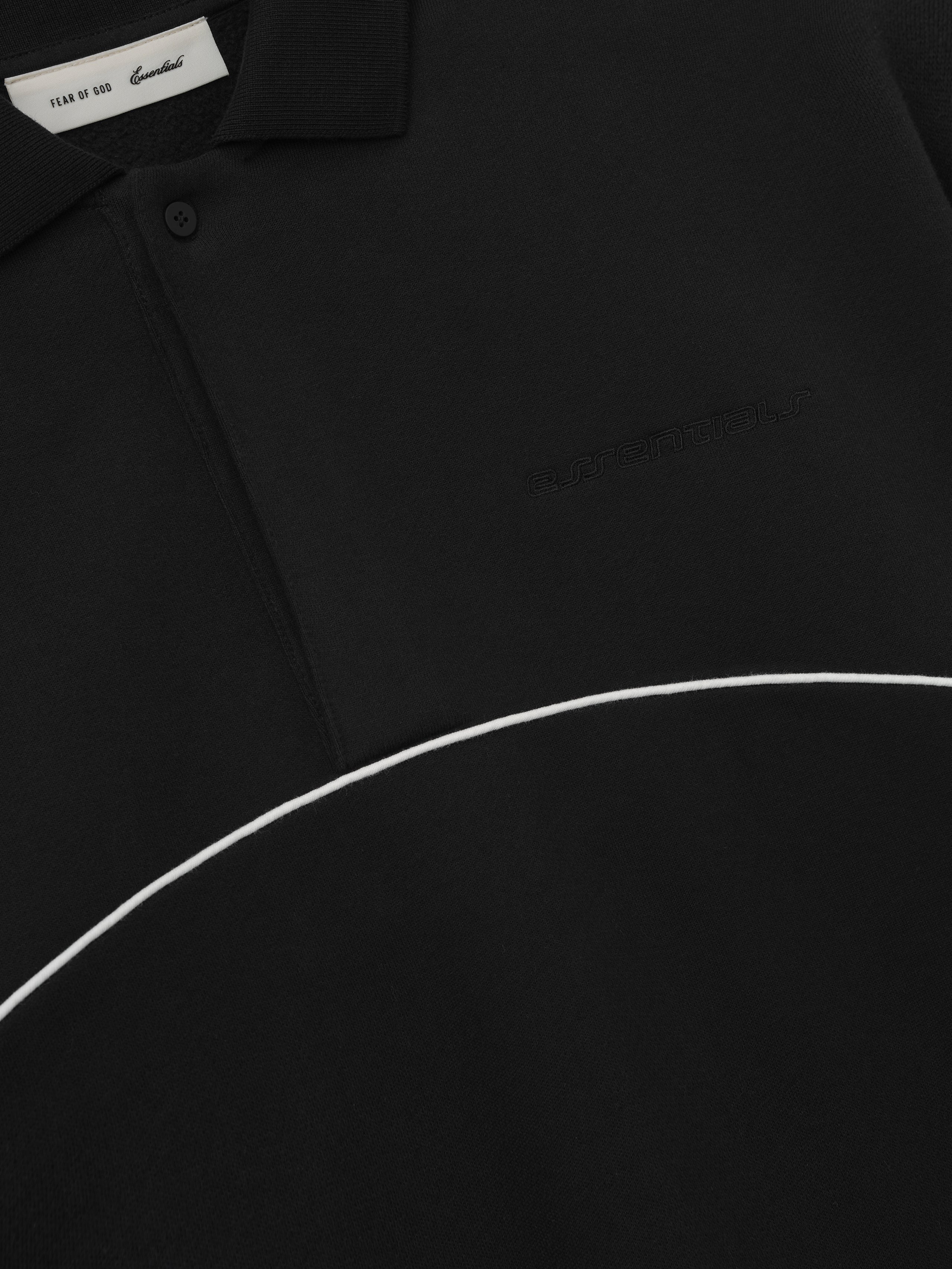 black modern polo sweatshirt with cropped fit, subtle embroidered logo on chest, and white curved piping detail