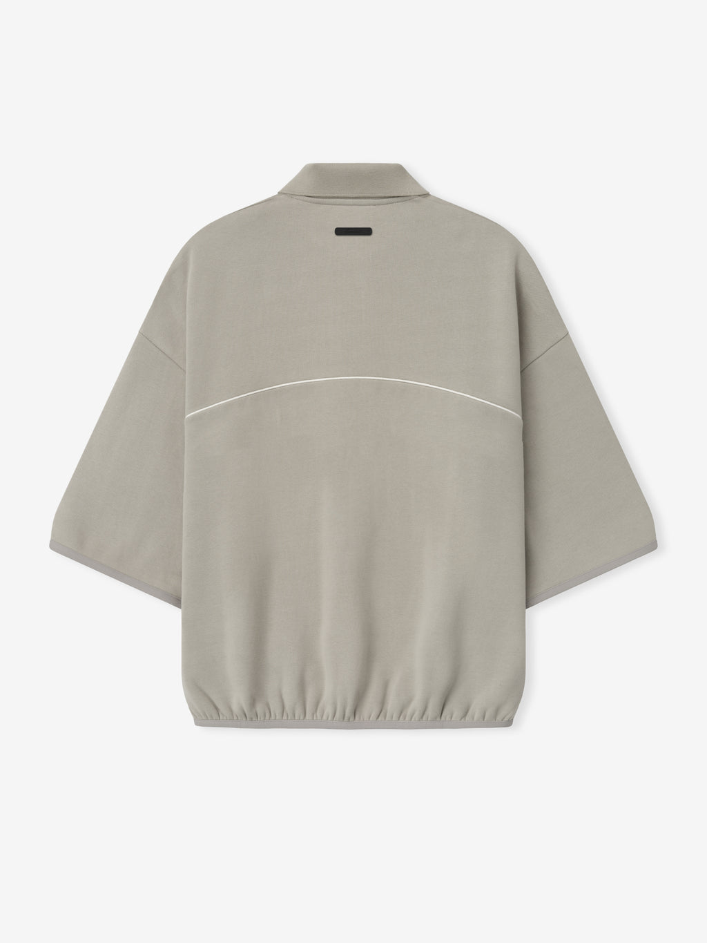 beige cropped modern polo sweatshirt with volume fit, 3/4 sleeves, elastic hem, and subtle white piping across back