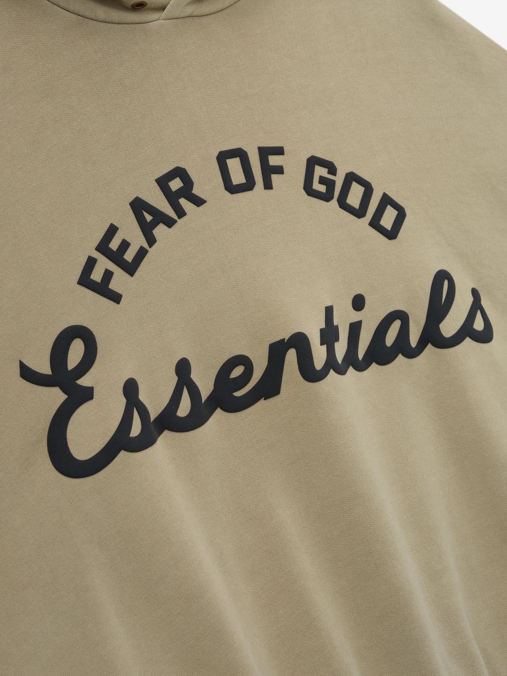 close-up of taupe cotton fleece hoodie with puff-printed Fear of God Essentials training logo on front