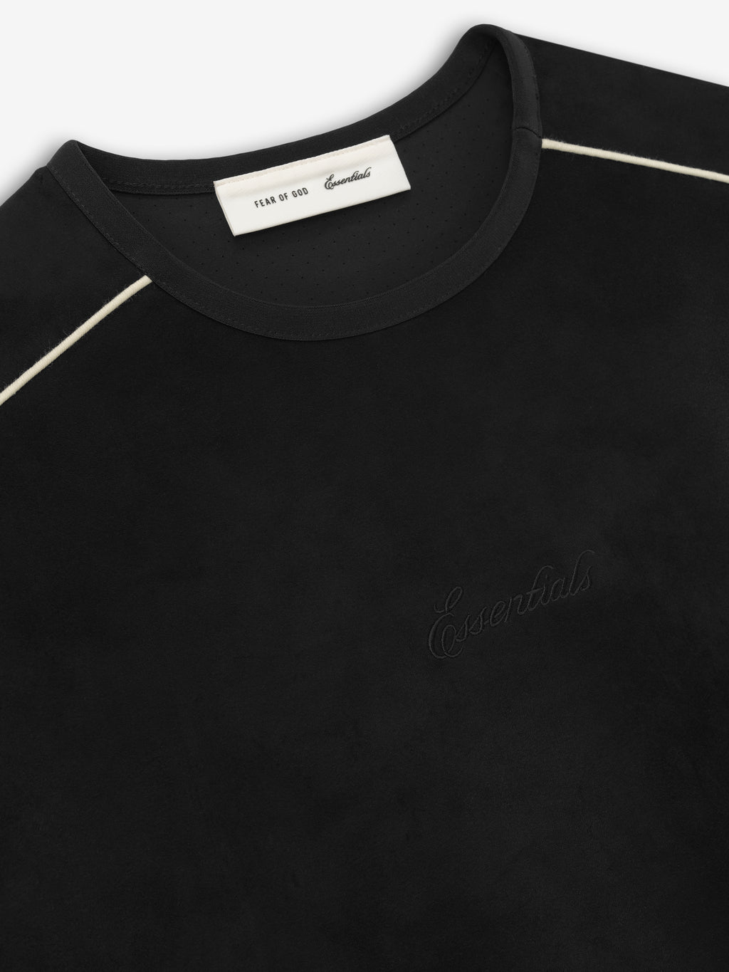 Black crewneck top with subtle embossed "Essentials" text on front and contrasting white piping along shoulder seams