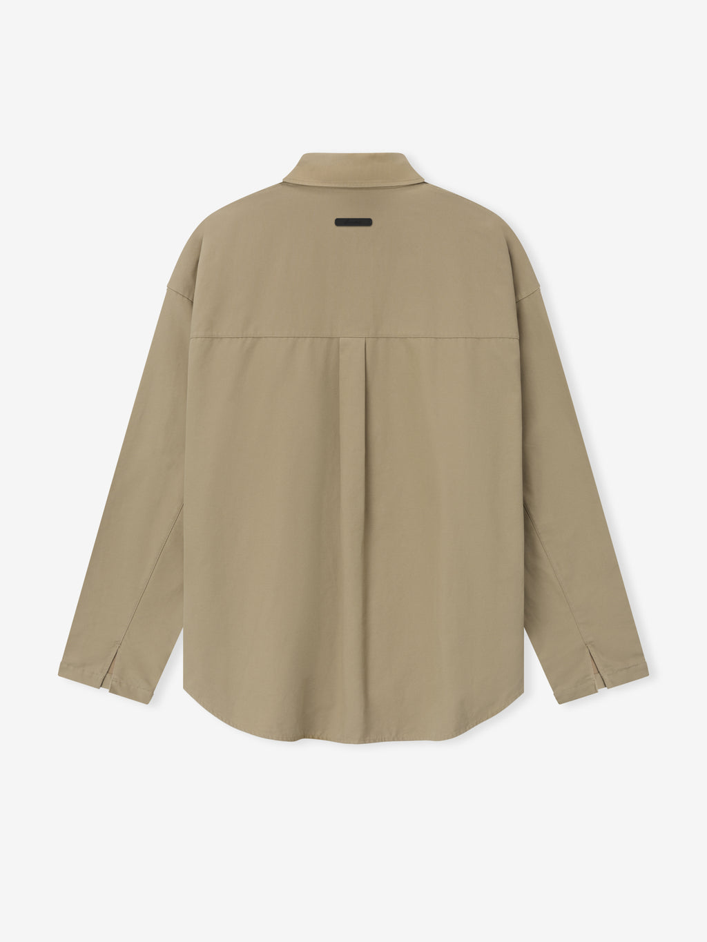 Back view of beige long-sleeve shirt with center pleat and small rectangular patch near collar on plain background