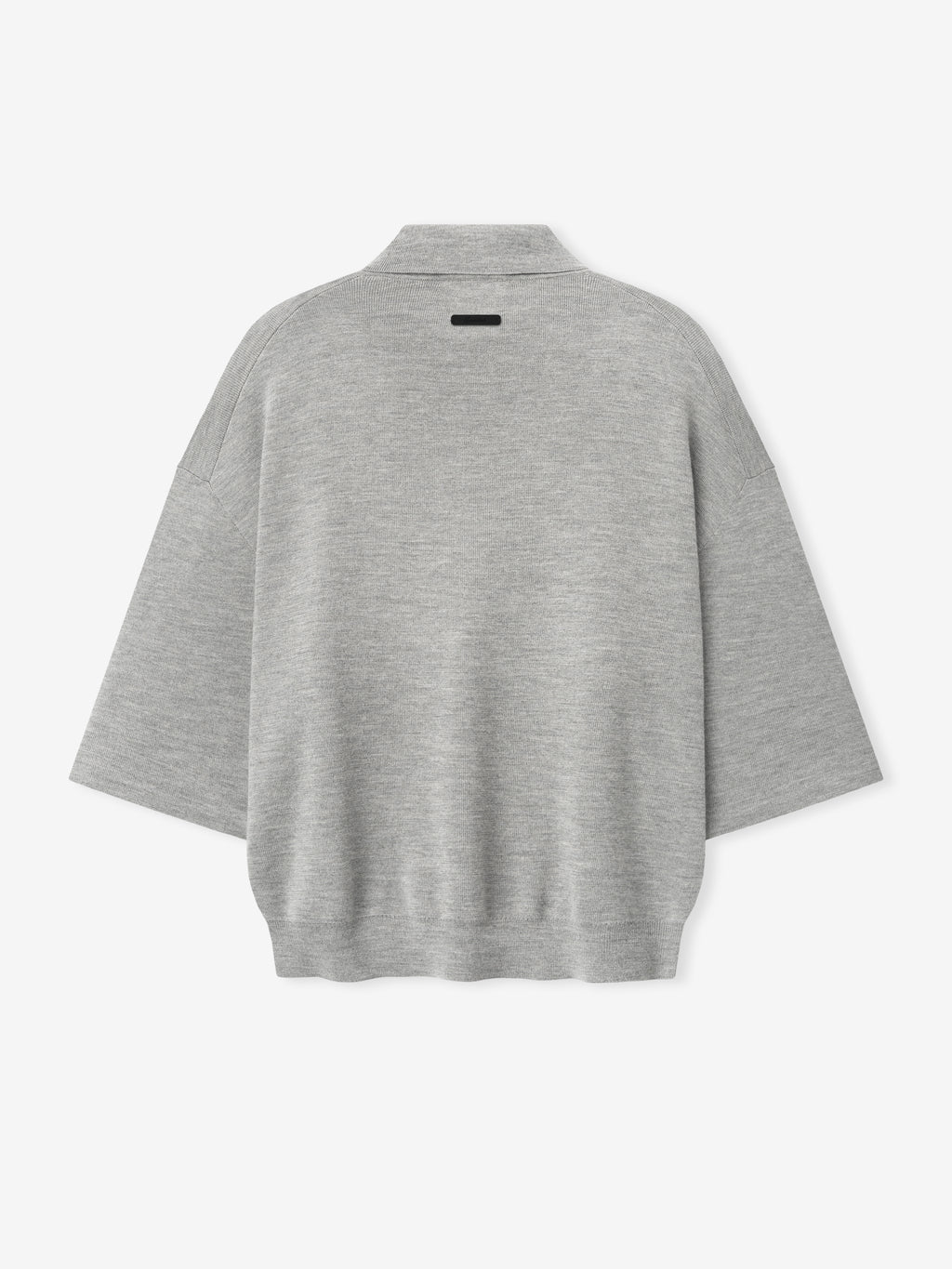 back view of light grey heavy merino knit polo with 3/4 sleeves and relaxed fit featuring small black label on neckline