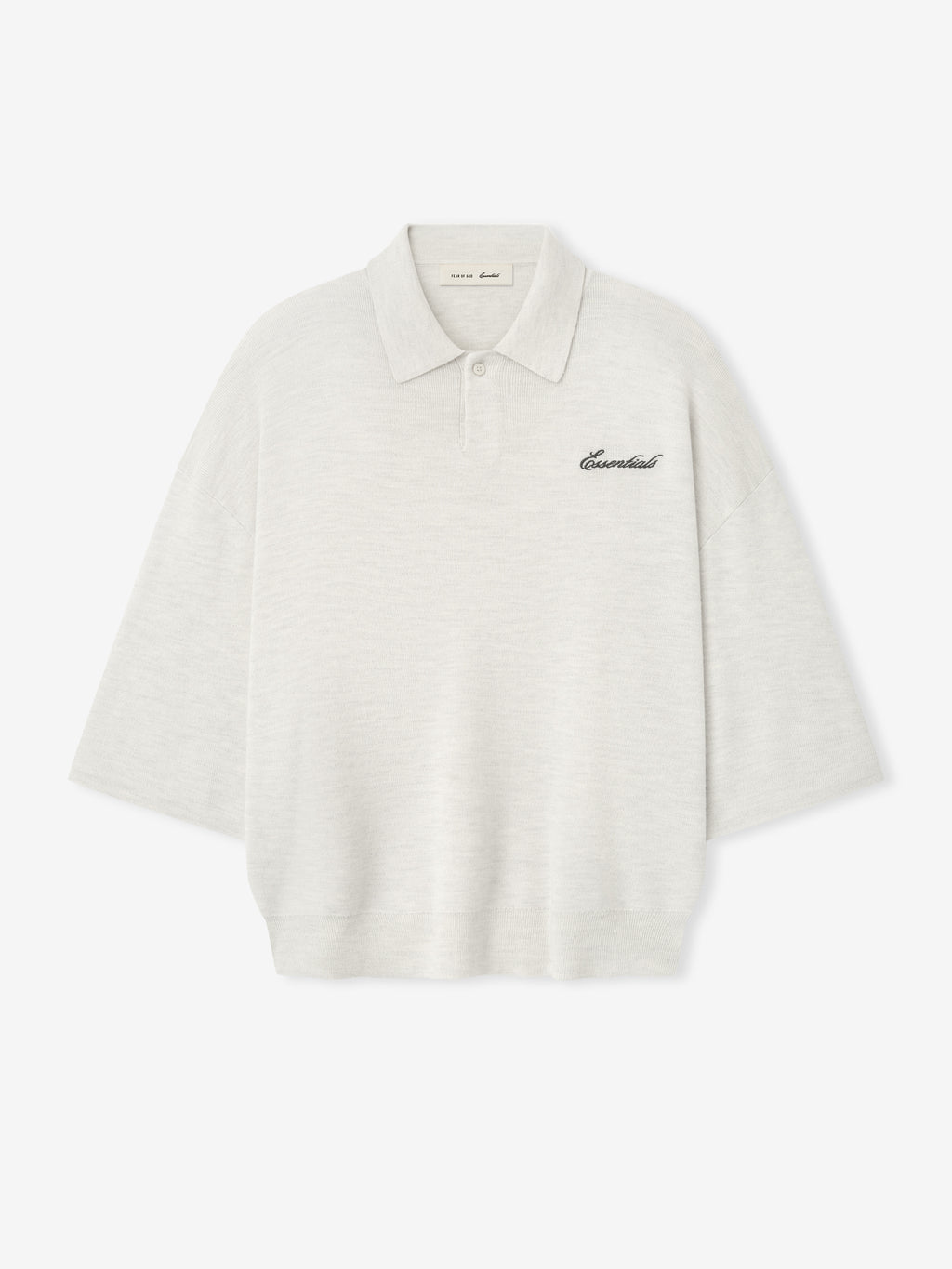 off-white heavy merino knit polo with 3/4 sleeves, relaxed fit, classic collar, and black Essentials script embroidery on chest