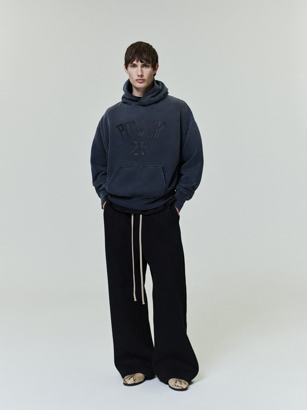 Vintage Power 25 Hoodie in faded dark gray featuring subtle textured lettering on the chest, designed as a relaxed outerwear top with a comfortable oversized fit.